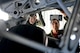 Will Krajewski (left), listens to Capt. Bobby Benitez, 4th Airlift Squaron pilot, Sept. 19, 2014, as he shows him the under carriage of a C-17 Globemaster III during his Pilot for a Day tour at Joint Base Lewis-McChord, Wash. In the C-17, Krajewski learned about the different types of missions the pilots fly and the numerous capabilities of the aircraft. (U.S. Air Force photo/Airman 1st Class Keoni Chavarria)