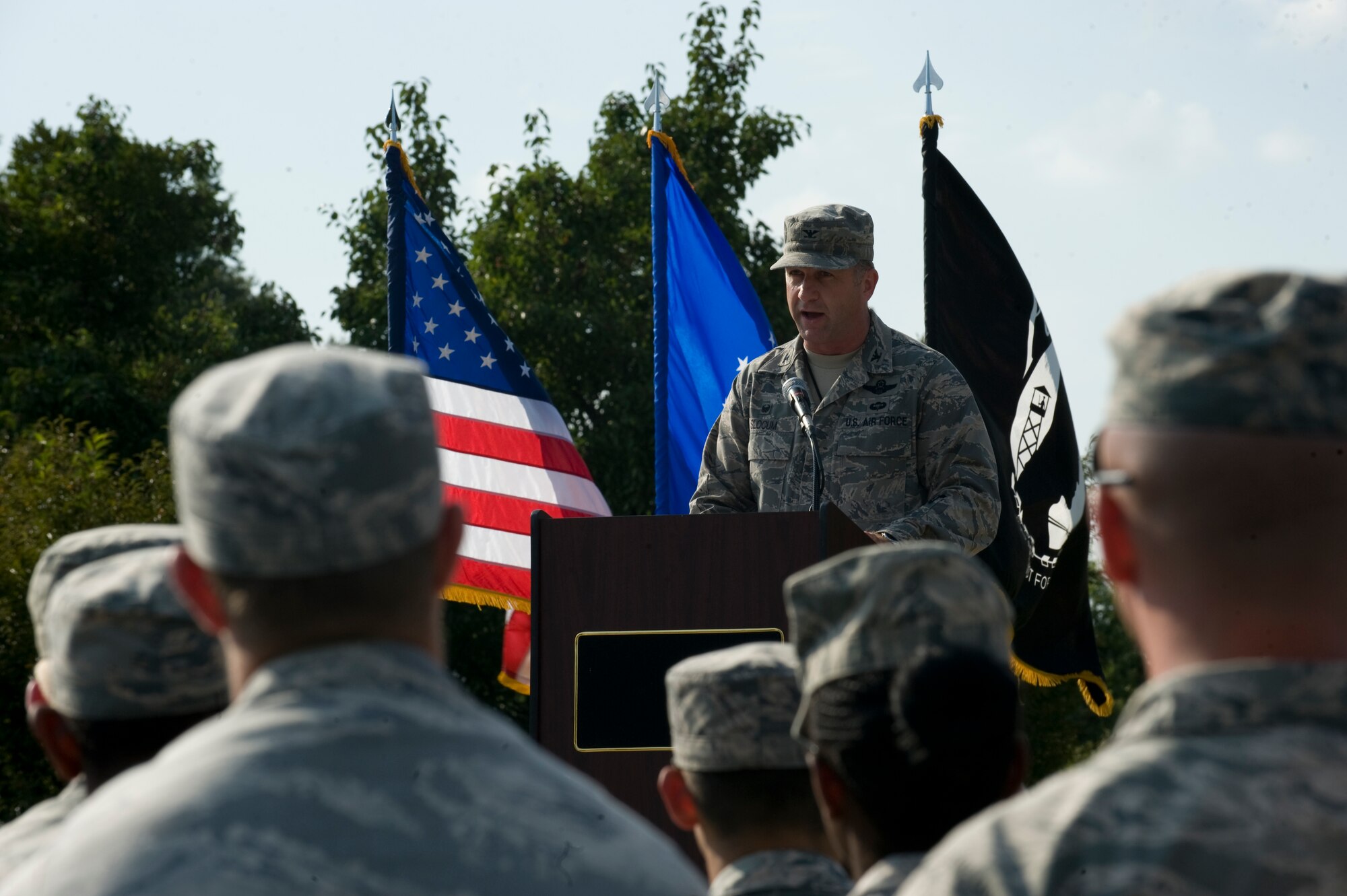 Col. Mark Slocum, 4th Fighter Wing commander, speaks during the POW/MIA Ceremony on Sept. 19, 2014, at Seymour Johnson Air Force Base, North Carolina. The ceremony, held in conjunction with national POW/MIA Recognition Day, also featured a missing-man formation flyover by four F-15E Strike Eagles assigned to the 4th FW, a reading of the Code of Conduct, a special presentation of the colors by the base honor guard and base leadership, and remarks by retired Army colonel and Medal of Honor recipient Walter J. Marm. (U.S. Air Force photo/Airman 1st Class Aaron Jenne)