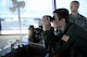 Will Krajeski, looks through a pair of binoculars, Sept. 19, 2014, from the control tower during his Pilot for a Day tour at Joint Base Lewis-McChord, Wash. While at the control tower, Krajewski was awarded by the 62nd Operations Support Squadron, a functional badge for an air traffic controller. (U.S. Air Force photo/Airman 1st Class Keoni Chavarria)