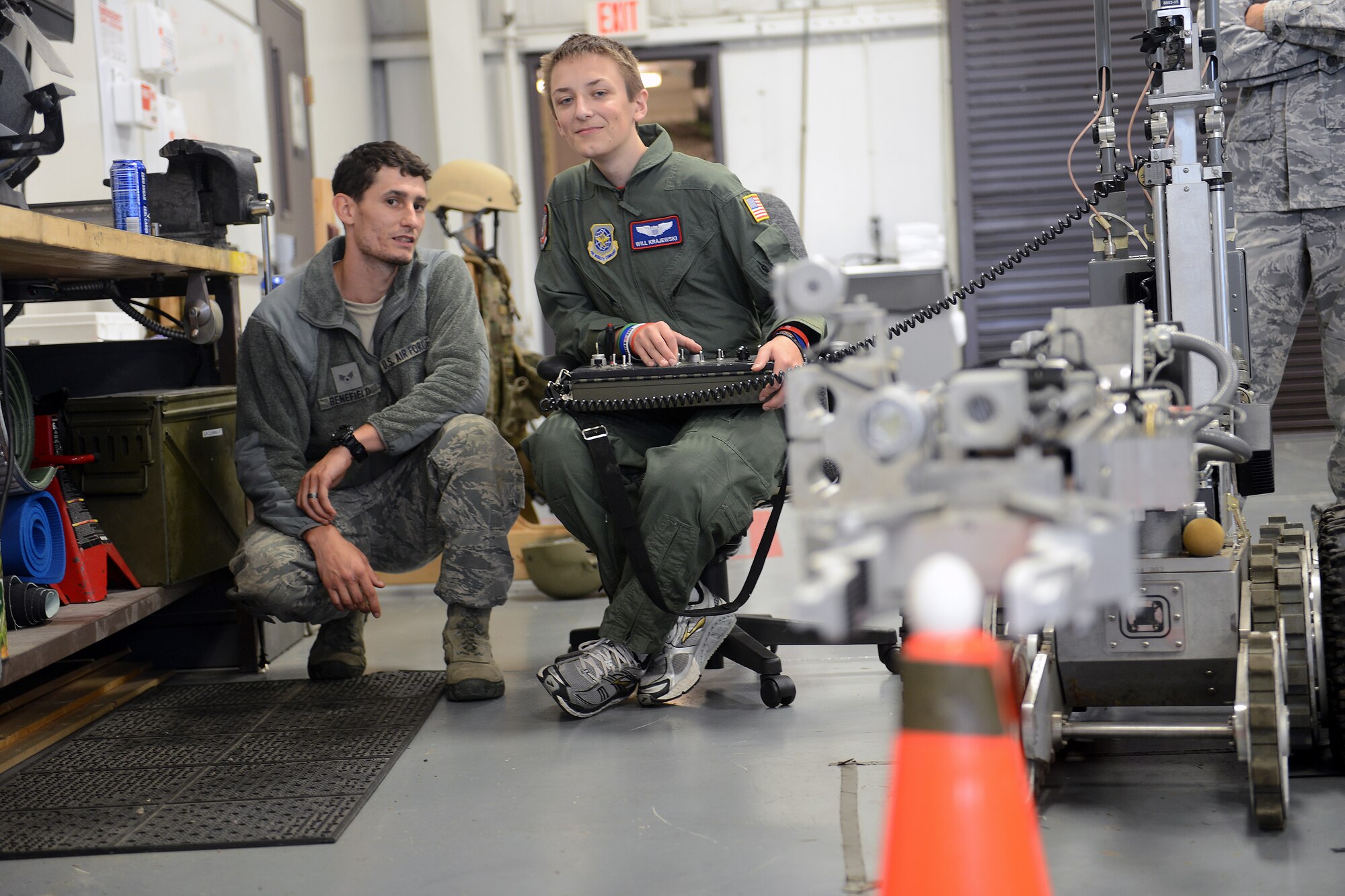 Will Krajewski (right), controls a robot while Senior Airman Christopher Benefield, 627th Civil Engineer Squadron explosive ordnance disposal journeyman gives him directions, Sept. 19, 2014, during his Pilot for a Day tour at Joint Base Lewis-McChord, Wash. The Pilot for a Day program allows children who have serious conditions to enjoy a day to be a guest of the 62nd Airlift Wing for an entire day. (U.S. Air Force photo/Airman 1st Class Keoni Chavarria)