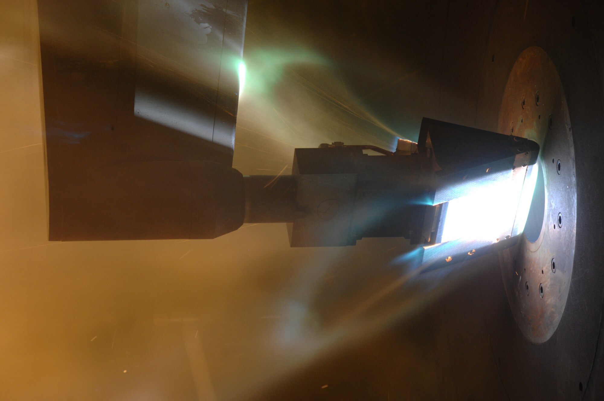 An Orion Crew Exploration Vehicle heat shield material sample model undergoes preproduction aerothermal testing in the H2 test facility as part of a facility validation and calibration run. (Photo by Rick Goodfriend)