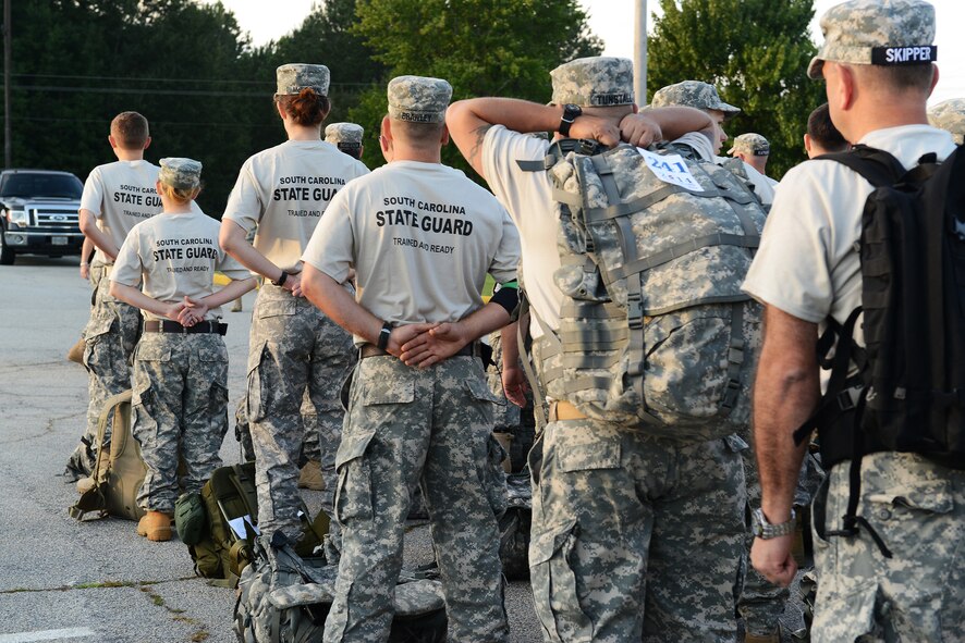 Event participants stand in formation to prepare for the Hurricane Hike at the Camden National Guard Armory, Camden, S.C., Sept. 20, 2014. The hike symbolized the guard’s readiness to provide hurricane relief, search, rescue, and recovery, damage assessment, and route reconnaissance. (U.S. Air Force photo by Airman 1st Class Diana M. Cossaboom/Released)