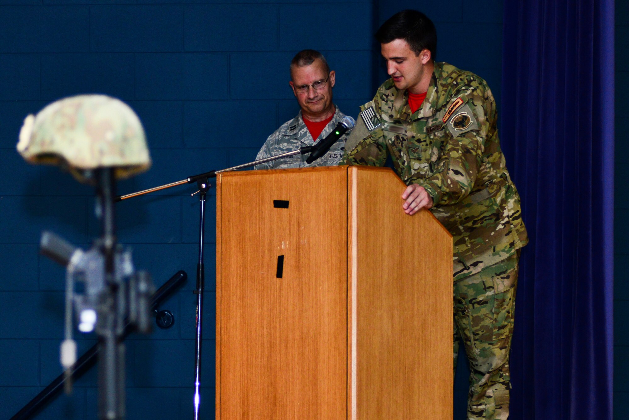 A U.S. Air Force Senior Airman assigned to the 30th Intelligence Squadron reminisces on the memories he shared with Senior Airman Senior Airman Russell Mountain, a former 30th IS analyst, during a memorial ceremony at Langley Air Force Base, Va., Sept. 19, 2014. Several of Mountain’s friends spoke about when they met and the last time they came in contact with the Airman. Mountain passed away in a motorcycle accident August 22. (U.S. Air Force photo by Senior Airman Aubrey White/Released)