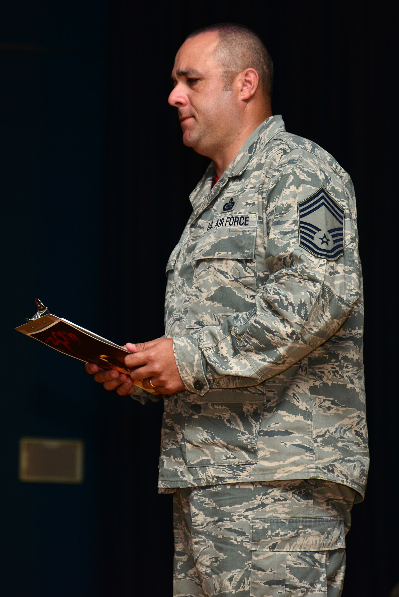 A U.S. Air Force chief master sergeant assigned to the 30th Intelligence Squadron conducts the final roll call during a memorial ceremony honoring Senior Airman Russell Mountain, a former 30th IS analyst, at Langley Air Force Base, Va., Sept. 19, 2014. The final roll call is called with the conviction held by Airmen that all unit members will be accounted for, and none will be forgotten. Mountain passed away August 22, and was a native of Tallahassee, Fla. (U.S. Air Force photo by Senior Airman Aubrey White/Released)