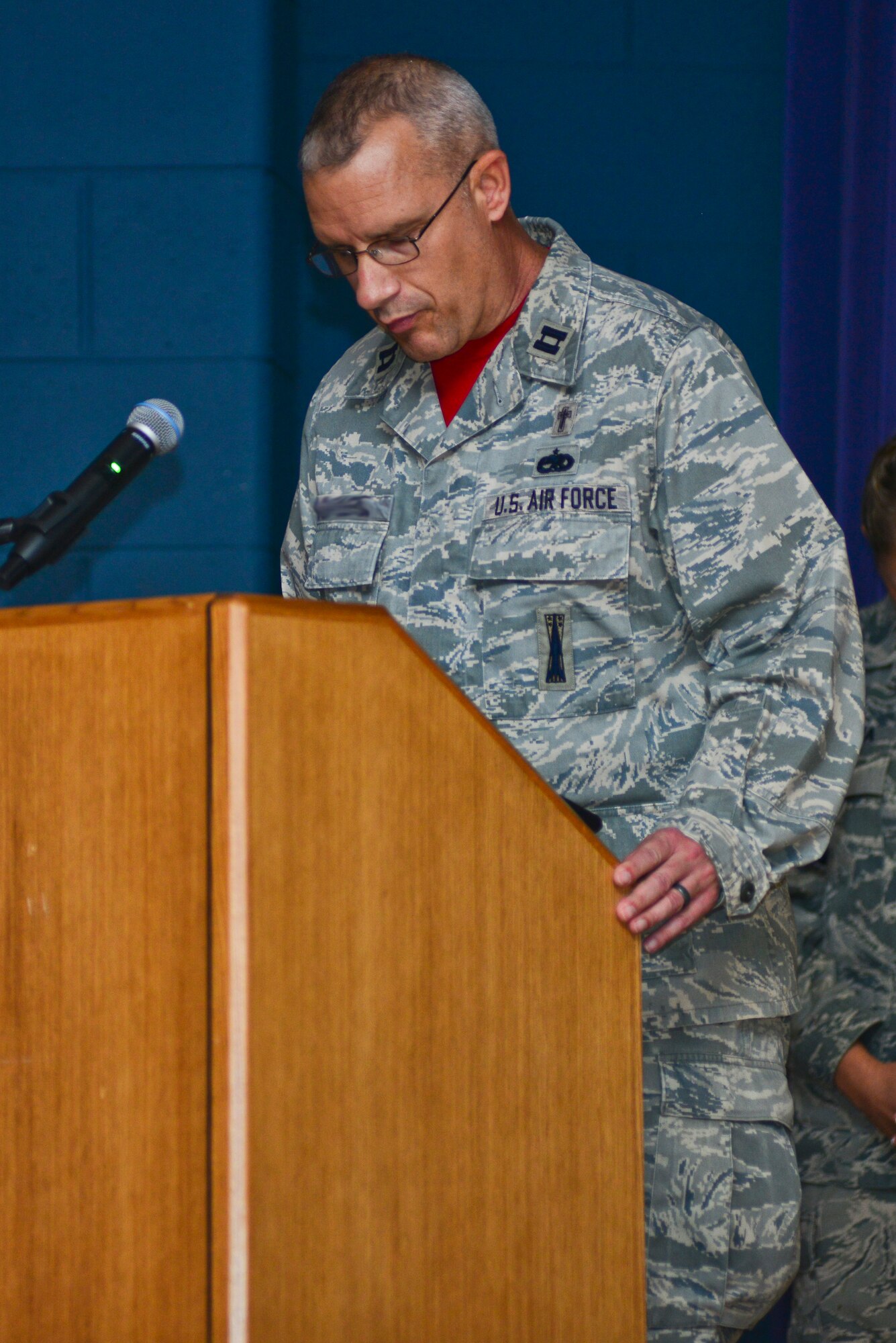 U.S. Air Force Chaplain (Capt.) Robert Duplease, 497th Intelligence, Surveillance and Reconnaissance Group chaplain, delivers the invocation during a memorial ceremony honoring Senior Airman Russell Mountain, Sept. 19, 2014. The chaplain spoke of grief and the ability to overcome a loved one’s passing. Mountain was a 30th Intelligence Squadron analyst and a native of Tallahassee, Fla. (U.S. Air Force photo by Senior Airman Aubrey White/Released) 