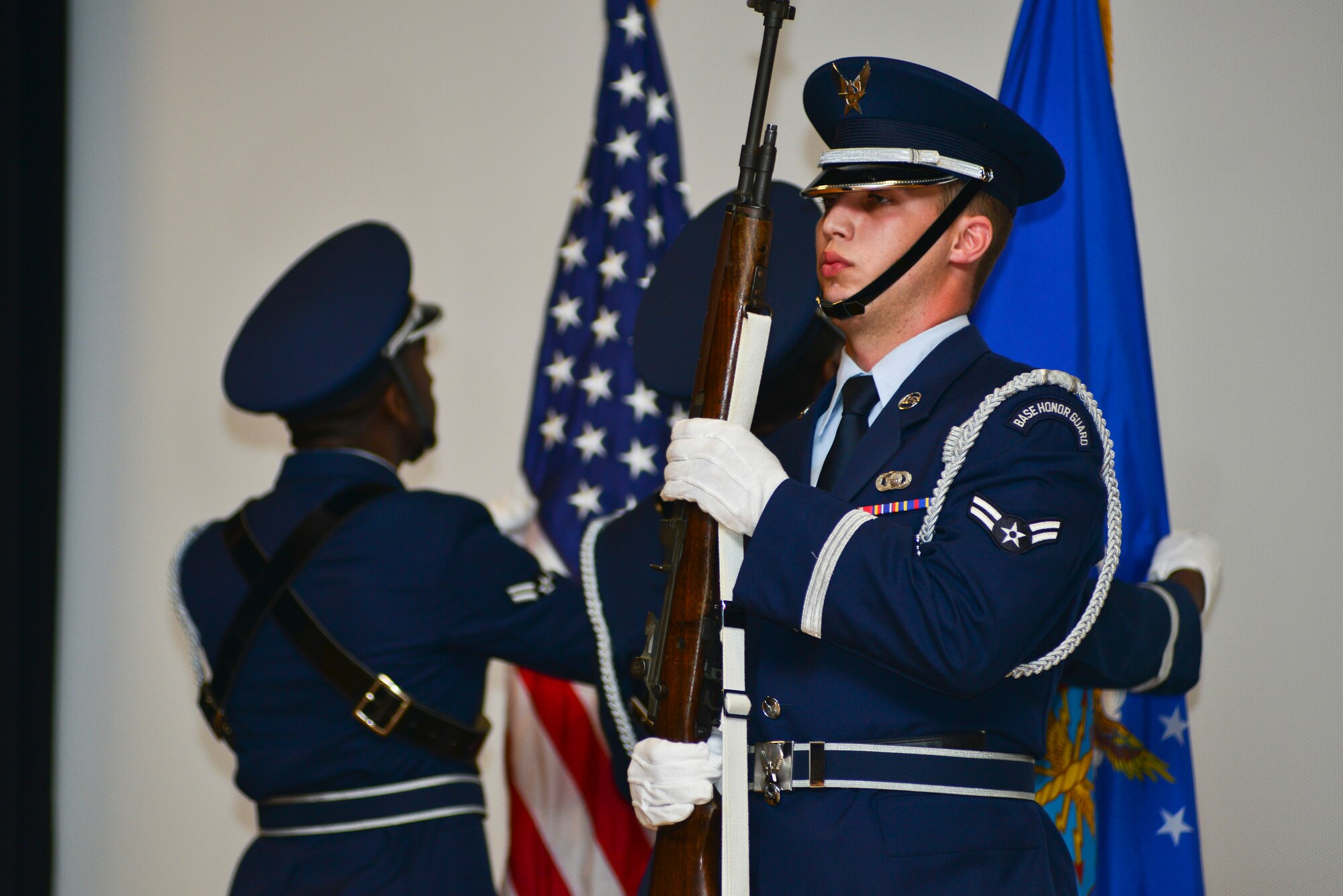 Base honor guardsmen post the colors during a memorial ceremony honoring Senior Airman Russell Mountain, Sept. 19, 2014. The honor guard carries out the primary mission of rendering funeral honors to veterans. Mountain was an analyst assigned to the 30th Intelligence Squadron who passed away August 22. (U.S. Air Force photo by Senior Airman Aubrey White/Released)