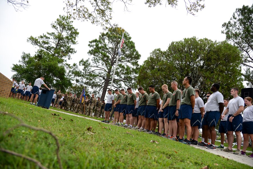 Airmen listen to closing remarks after running the Tiger-thon in recognition of prisoners of war and those missing in action Sept. 19, 2014, at Moody Air Force Base, Ga. There are currently 83,000 Department of Defense workers who are unaccounted for. (U.S. Air Force photo by Senior Airman Sandra Marrero/Released)
