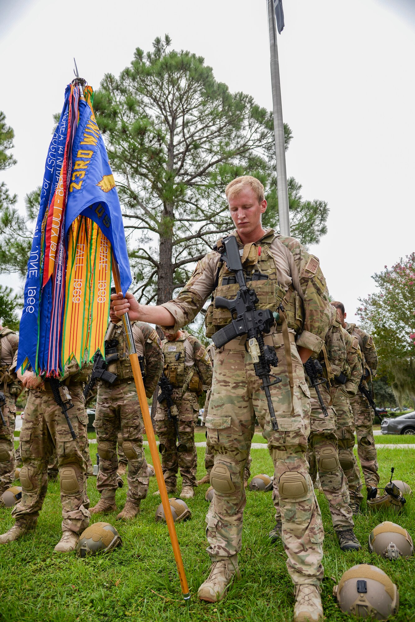 U.S. Air Force Staff Sgt. Josiah Wuerffel, 38th Rescue Squadron pararescueman, bows his head during a moment of silence after the Tiger-thon run Sept. 19, 2014. This Tiger-thon was the 6th annual 23-mile run in remembrance of prisoners of war and those missing in action. (U.S. Air Force photo by Senior Airman Sandra Marrero/Released)
