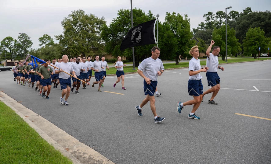 Runners wrap up the final mile of the Tiger-thon run Sept. 19, 2014, at Moody Air Force Base, Ga.  Runners began on base, moved through the local community and ended at the base’s prisoner of war/missing-in-action memorial. (U.S. Air Force photo by Senior Airman Sandra Marrero/Released)
