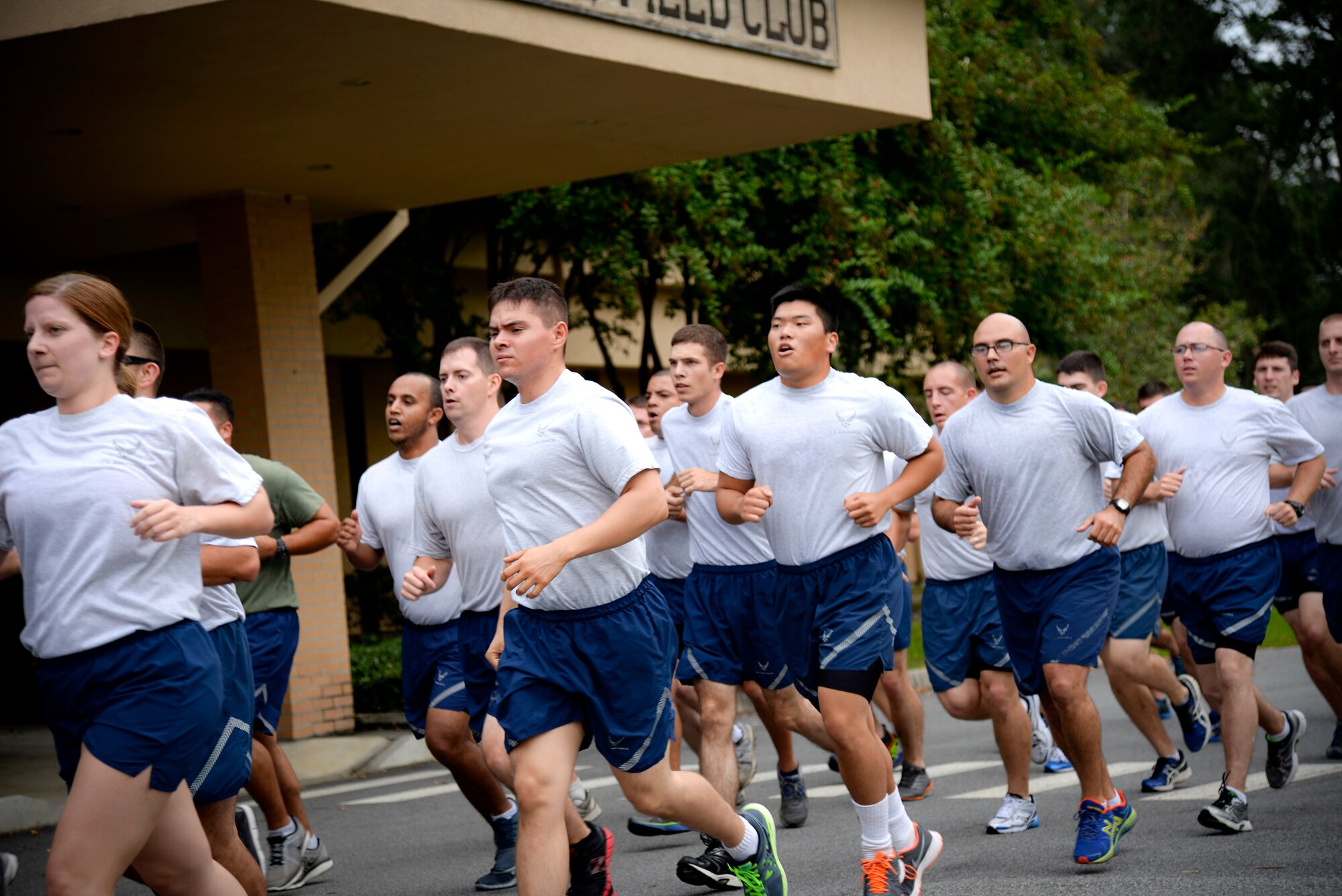 Airmen participate in the 23-mile Tiger-thon run Sept. 19, 2014, at Moody Air Force Base, Ga.  People from 23 base organizations took turns running with a prisoner of war/missing-in-action guidon in honor of prisoners of war or those who are missing in action. (U.S. Air Force photo by Senior Airman Sandra Marrero/Released)
