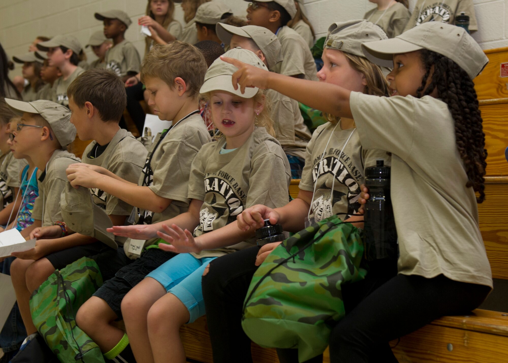 Team Holloman youth “deployers” gather in the Youth and Teen Center for a briefing to kick off Operation Kids Investigating Deployment at Holloman Air Force Base N.M., Sept 22. Operation K.I.D. is an event put on for military youth that teaches them the deployment process. Youth ages 5-13 go through a mock deployment at the 49th Materiel Maintenance Group and receive military orders, gear and a uniform. The children also learn about safety and the conditions of their mock destination. This annual event is held to give kids a better understanding on what it’s like when their loved ones prepare for deployment. (U.S. Air Force photo by Senior Airman Leah Ferrante/Released)