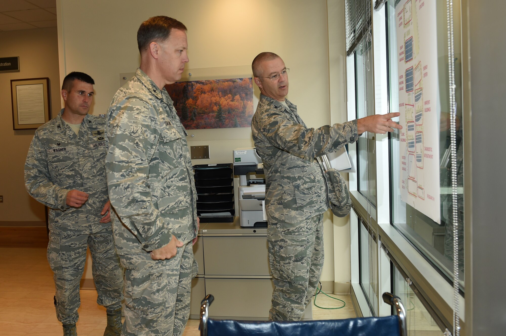Col. Michael Kindt, 460th Medical Group commander, right, shows Brig. Gen. Steven Garland, 14th Air Force vice commander, left, the future plans for the Veterans Affairs Joint Venture Buckley Clinic Sept. 22, 2014, in Aurora, Colo. Buckley Air Force Base is Garland’s first stop on a tour of Air Force Space Command bases after becoming vice commander of the 14th AF in July 2014. (U.S. Air Force photo by Airman 1st Class Samantha Saulsbury/Released)