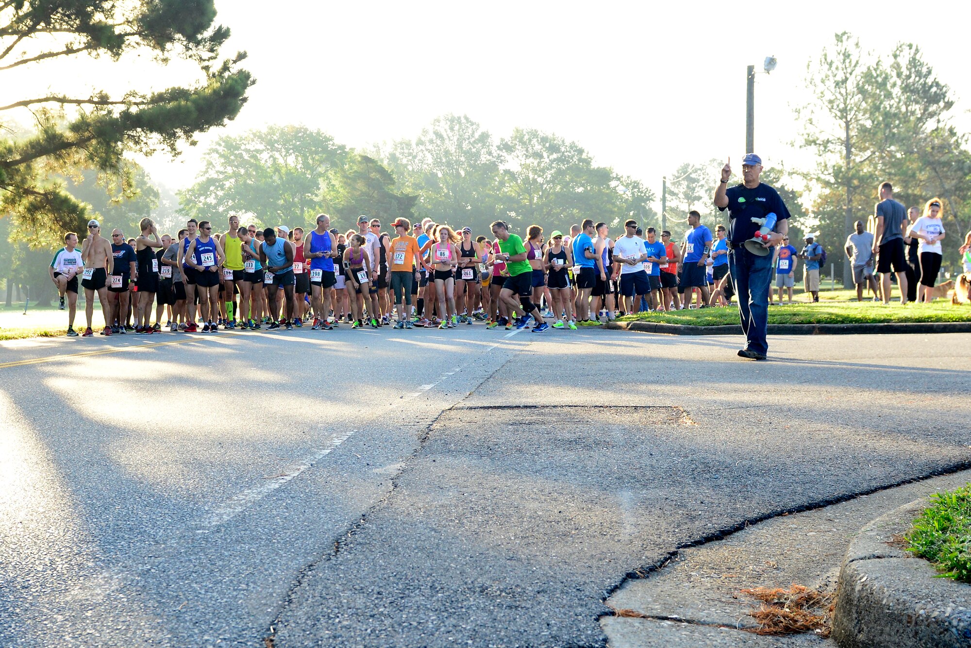Runners geared up to run the 33rd Annual Mulberry Island Half-Marathon and 5K at Fort Eustis, Va., Sept. 20, 2014. As the longest-held race at the installation, the 5K and half-marathon are intended to bring the military and local communities together while giving participants a tour of the island, which was established in colonial times. (U.S. Air Force photo by Airman 1st Class Kimberly Nagle/Released)