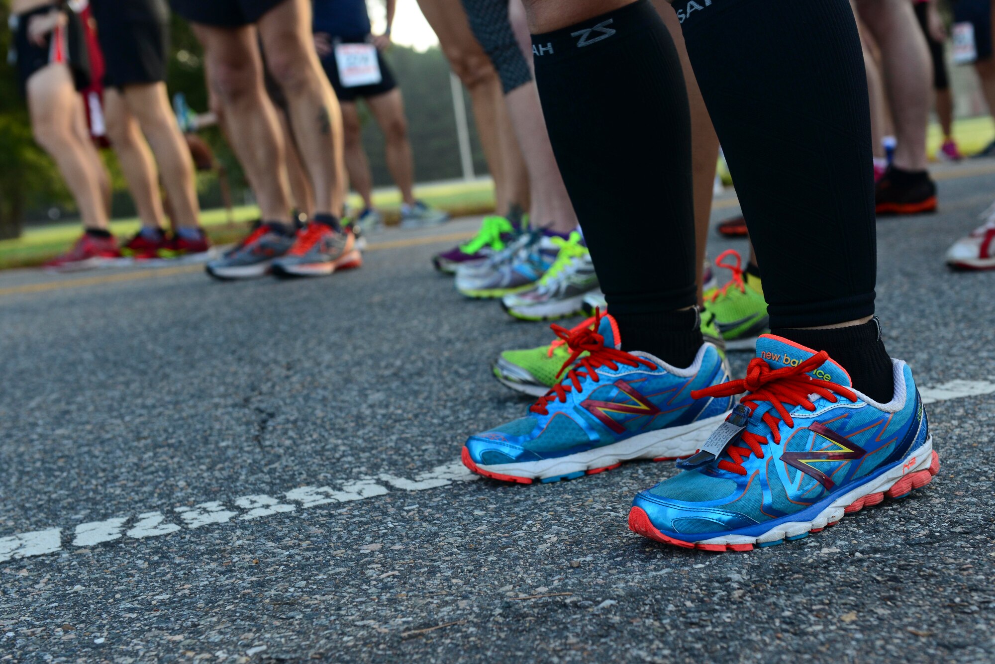 Runners participating in the 33rd Annual Mulberry Island Half-Marathon and 5K wait to begin the race at Fort Eustis, Va., Sept. 20, 2014. The course took participants on a route throughout the installation that began and ended at Anderson Field House, taking the runners past the Matthew James House, along the James River and past the site of an early American brick factory located on Mulberry Island. (U.S. Air Force photo by Airman 1st Class Kimberly Nagle/Released) 