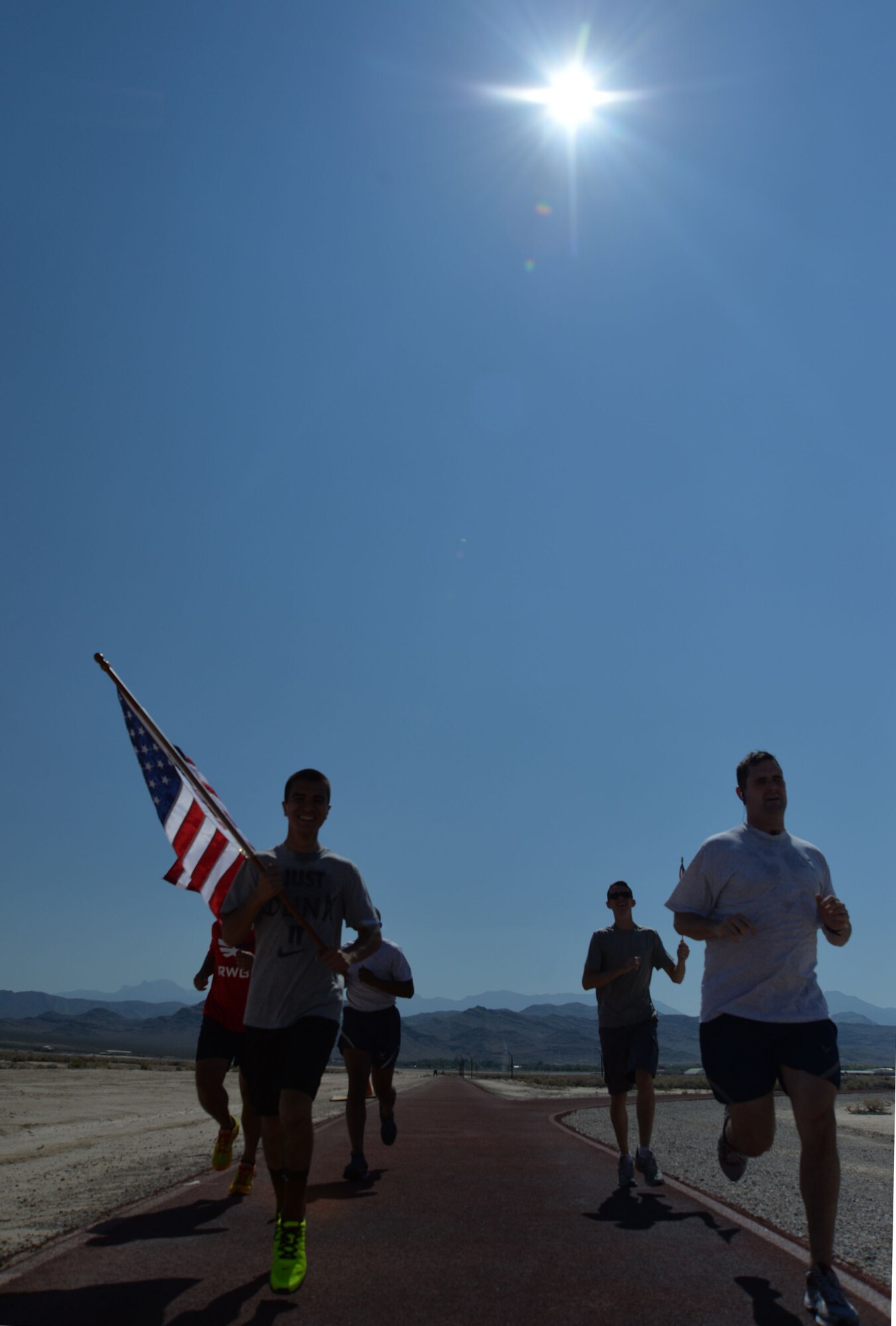 Airmen from Creech Air Force Base participated in a Team Red, White and Blue Coast-to-Coast relay race while carrying American flags on the 13th anniversary of the Sept. 11, 2001, attacks on the United States.  The 24-hour relay took place to honor those lost on Sept. 11, 2001, and those who have paid the ultimate sacrifice in the defense of our country. (U.S. Air Force photo by Tech. Sgt. Nadine Barclay/RELEASED)