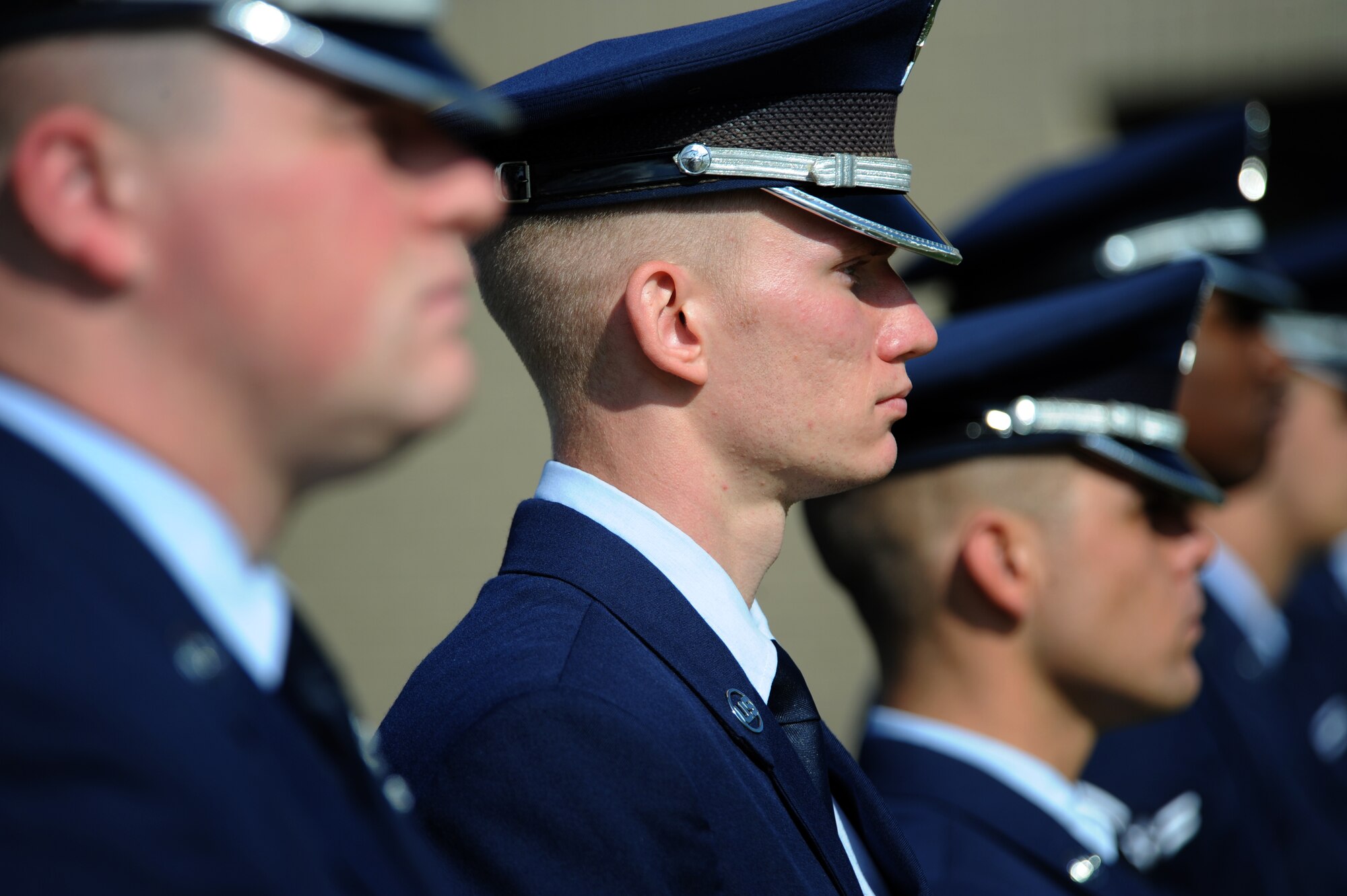 Members of the Dover Air Force Base Honor Guard stand quietly prior to a POW/MIA Remembrance Day retreat ceremony Sept. 19, 2014 at Dover Air Force Base, Del. The Honor Guard performed retreat, taps and a 21-gun salute at the ceremony. (U.S. Air Force photo/Staff Sgt. Elizabeth Morris)