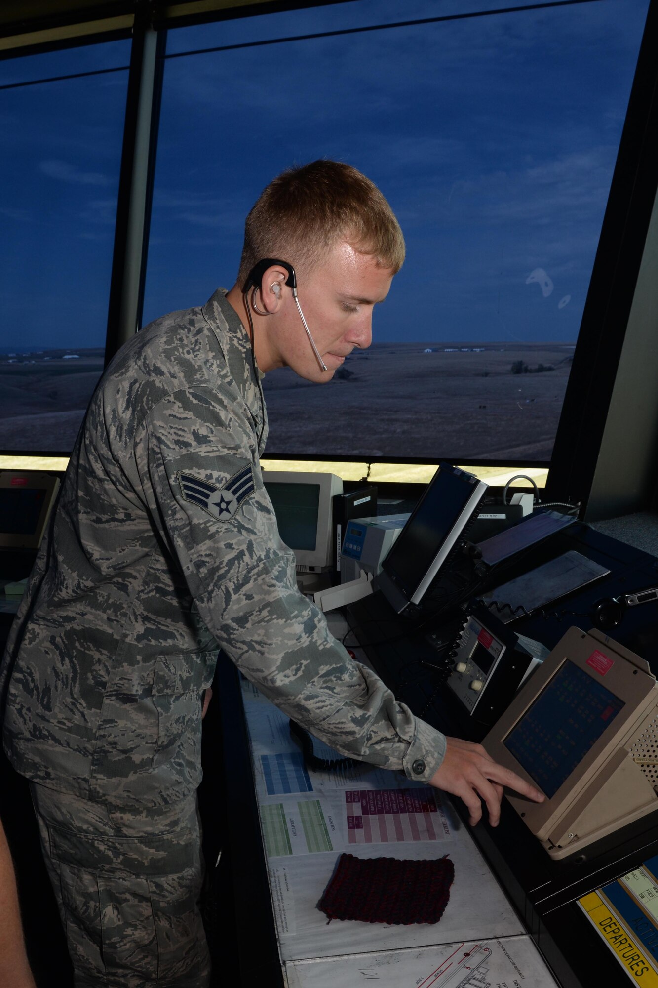 Senior Airman Andrew Ahrendt, 28th Operations Support Squadron air traffic controller, makes contact with ground crews at Ellsworth Air Force Base, S.D., Sept. 22, 2014. Controllers work with many base agencies including ground crews, weather, the fire department and airfield management to ensure that they are fully aware of all possible flight complications and are able to relay important information to the aircrew. (U.S. Air Force photo by Airman 1st Class Rebecca Imwalle/ Released)