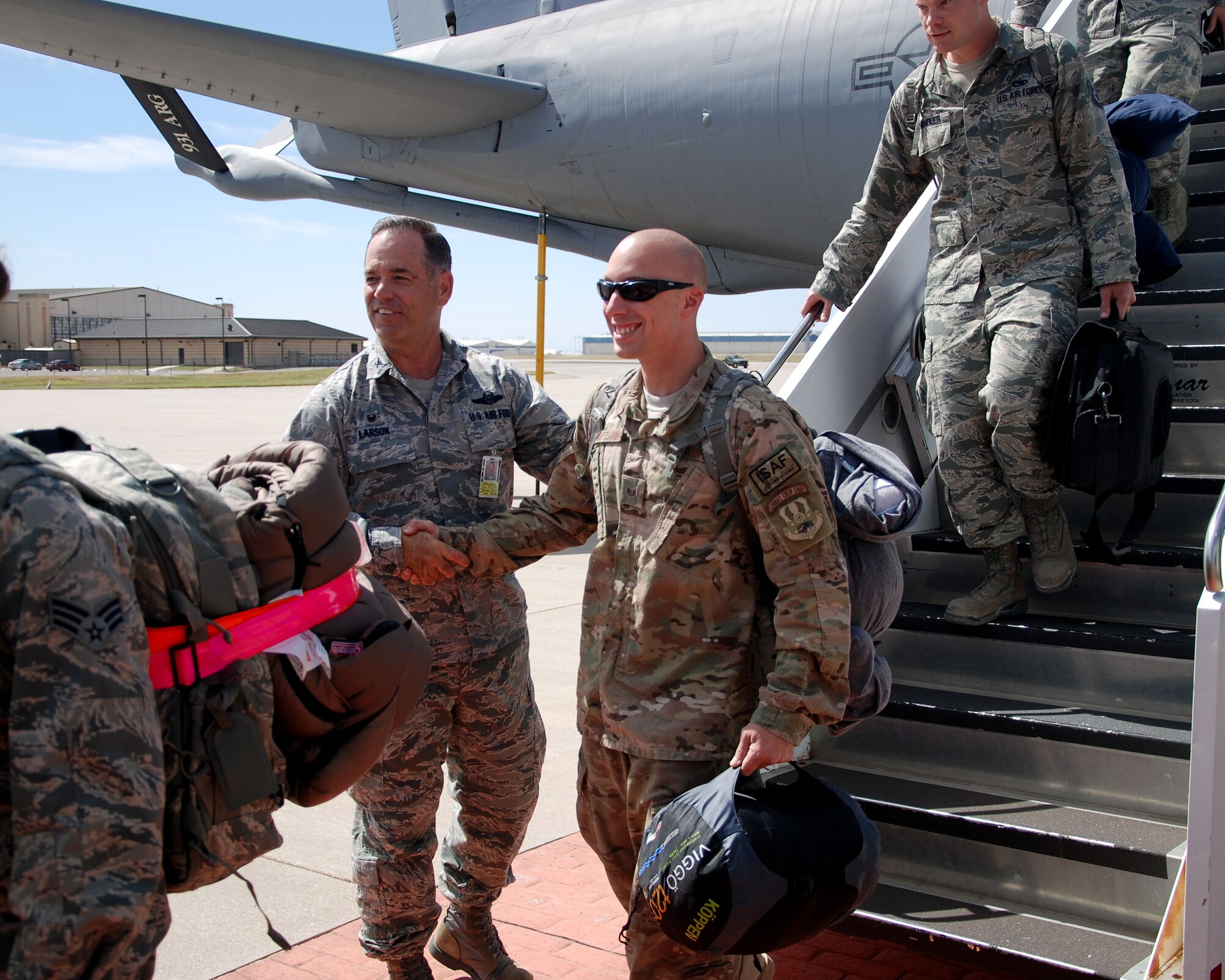 Col. Mark S. Larson, 931st Air Refueling Group commander, greets members of the 931st ARG, as they return from a 120-day deployment to Southwest Asia at McConnell Air Force Base, Kan., Sept. 22, 2014.  During the deployment, the 931 ARG performed aircraft maintenance and filled other support roles while assigned to the 379th Air Expeditionary Wing. (U.S. Air Force photos by Staff Sgt. Abigail Klein)
 