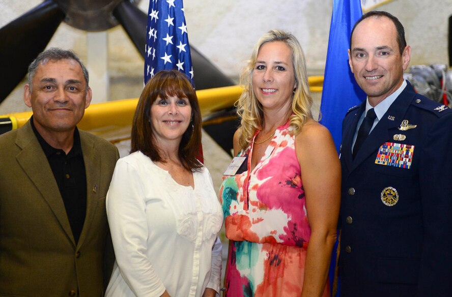 Mutch Usera, director of External Affairs for Black Hills Corporation, was named the honorary commander for the 28th Bomb Wing commander during a special event at the South Dakota Air and Space Museum Sept. 18, 2014. Pictured are Mutch, his wife, Char, Cindy Kennedy and the 28th BW commander, Col. Kevin Kennedy. (U.S. Air Force photo by Senior Airman Zachary Hada/Released).