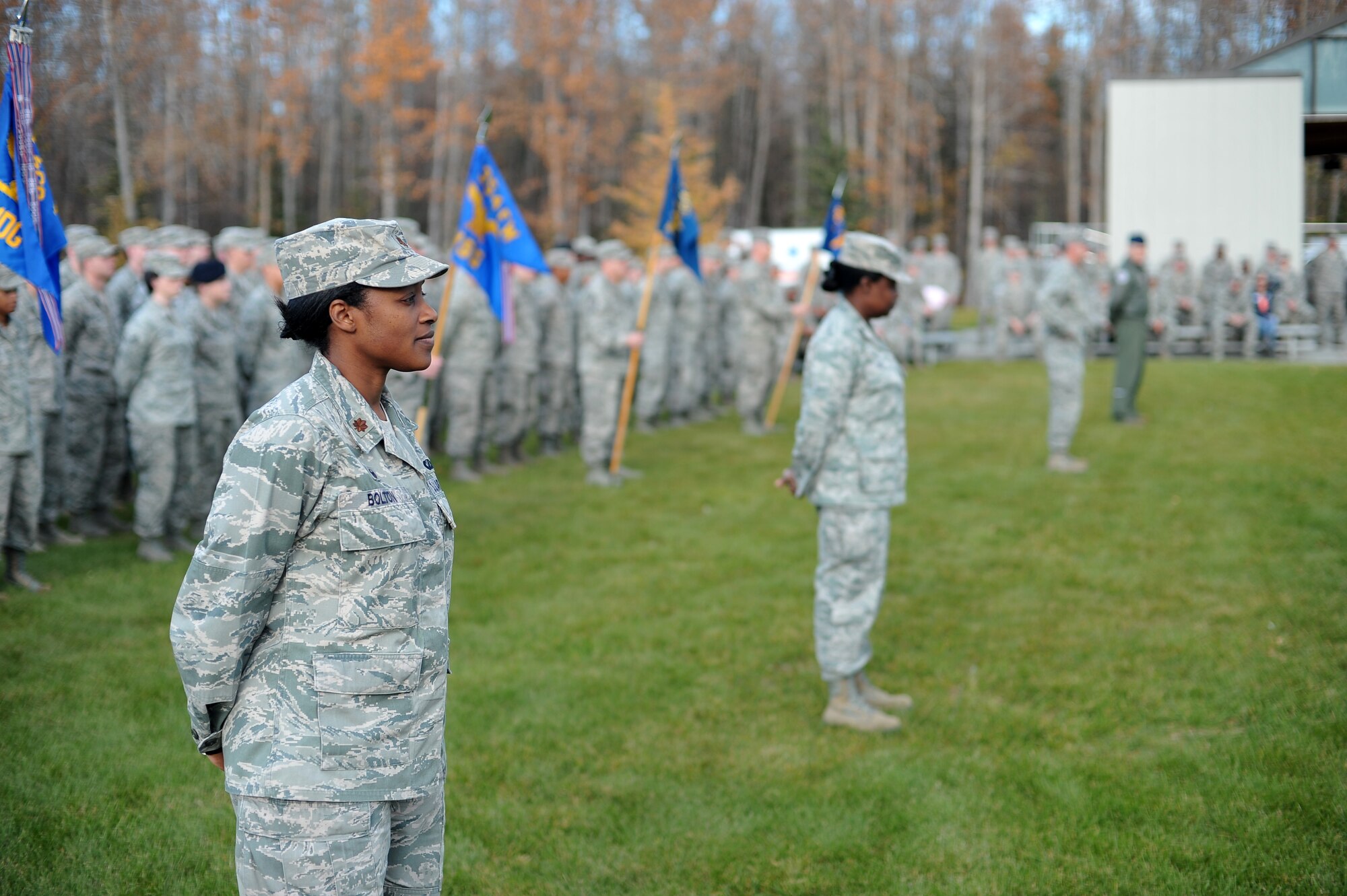 U.S. Air Force Maj. Shellonda Bolton, the 354th Comptroller Squadron commander, stands in formation during a POW/MIA memorial ceremony Sept. 19, 2014, at Eielson Air Force Base, Alaska. The ceremony concluded a 24-hour vigil run dedicated to American prisoners of war and those missing in action. (U.S. Air Force photo by Staff Sgt. Jim Araos/Released)
