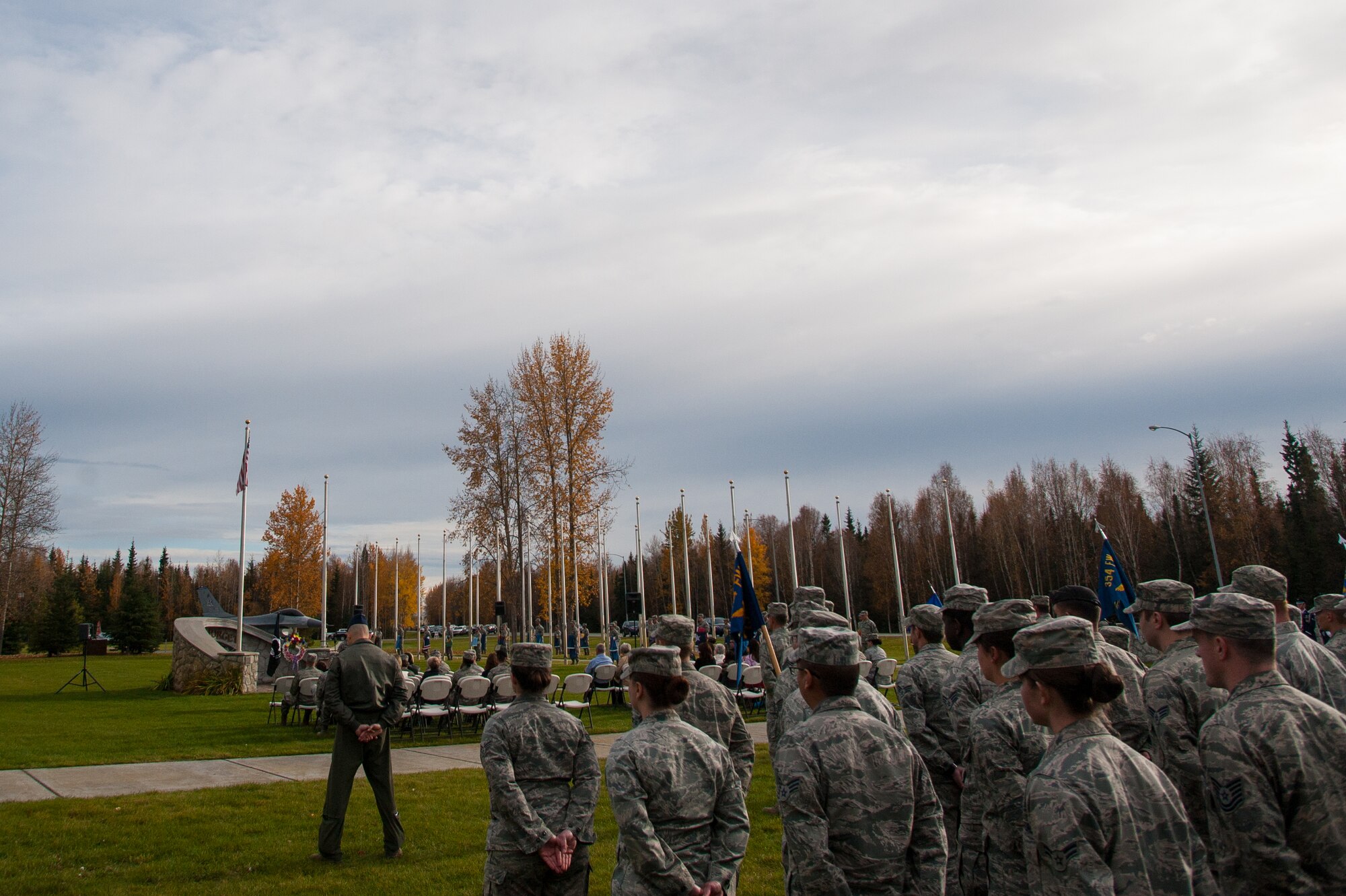 U.S. Airmen assigned to the 354th Fighter Wing stand in formation during the National POW/MIA Recognition Day Ceremony at Eielson Air Force Base, Alaska, Sept. 19, 2014.  The third Friday of September each year is observed across the United States as National POW/MIA Recognition Day to honor prisoners of war and the missing as well as their families and highlights the government's commitment to account for them. (U.S. Air Force photo by Tech. Sgt. Joseph Swafford/Released)