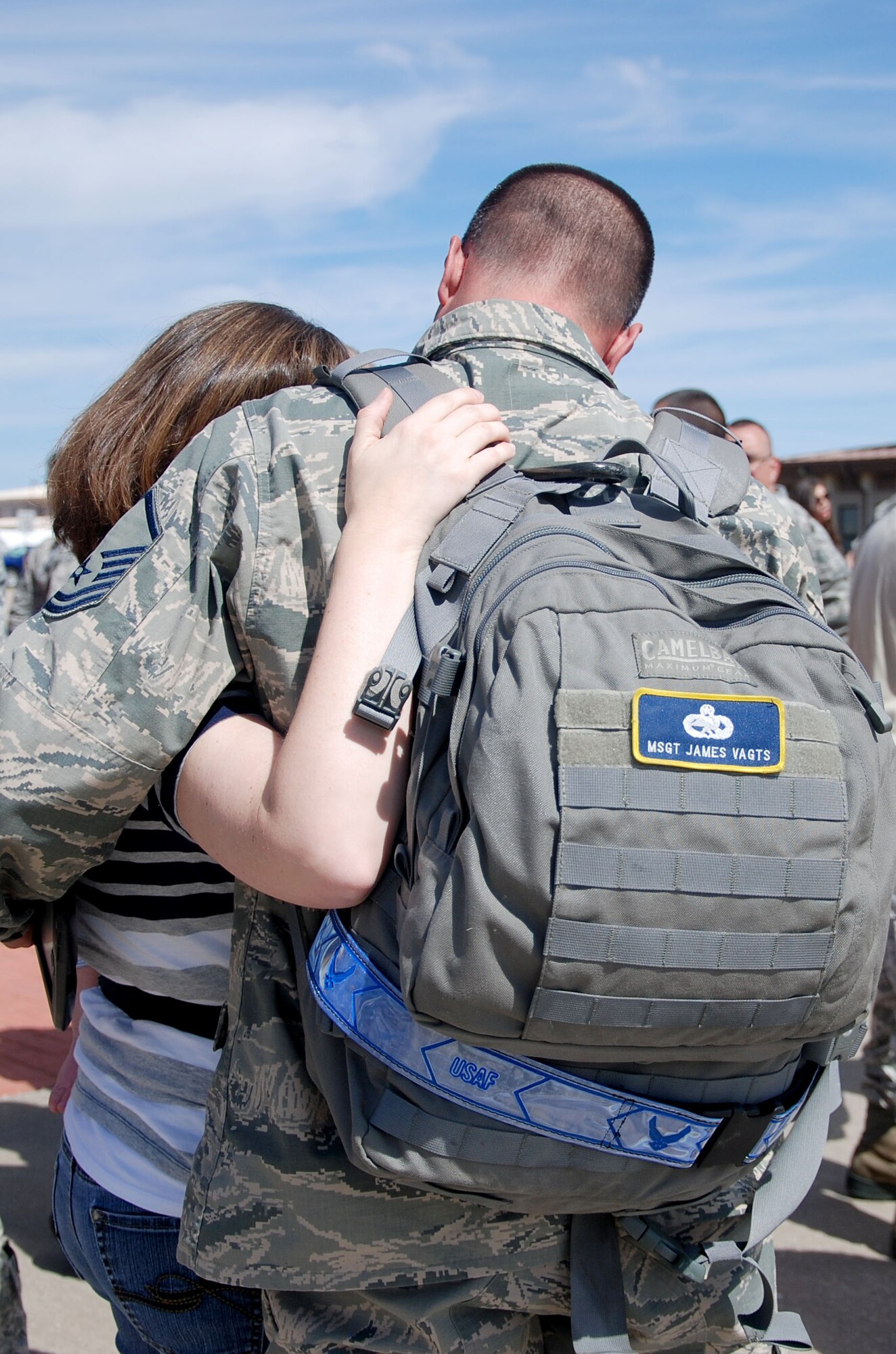 Master Sgt. James Vagts, 931st Aircraft Maintenance Squadron section chief, greets his spouse at McConnell Air Force Base, Kan., Sept. 22, 2014.  Vagts returned with 15 other members of the 931st Air Refueling Group, after a 120-day deployment to Southwest Asia.  (U.S. Air Force photo by Staff Sgt. Abigail Klein)