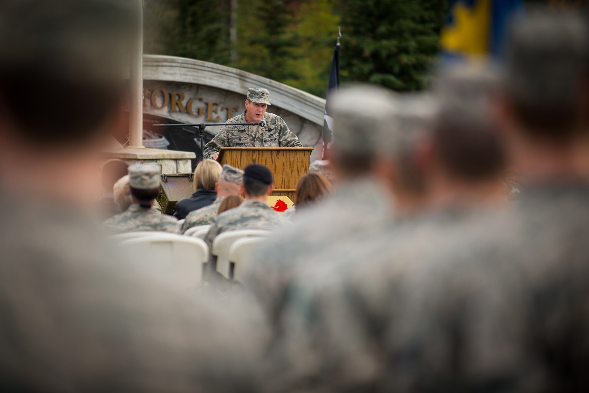 U.S. Air Force Col. Michael Winkler, 354th Fighter Wing commander, gives a speech during the National POW/MIA Recognition Day Ceremony at Eielson Air Force Base, Alaska, Sept. 19, 2014.  The third Friday of September each year is observed across the United States as National POW/MIA Recognition Day to honor prisoners of war and the missing as well as their families and highlights the government's commitment to account for them. (U.S. Air Force photo by Tech. Sgt. Joseph Swafford/Released)