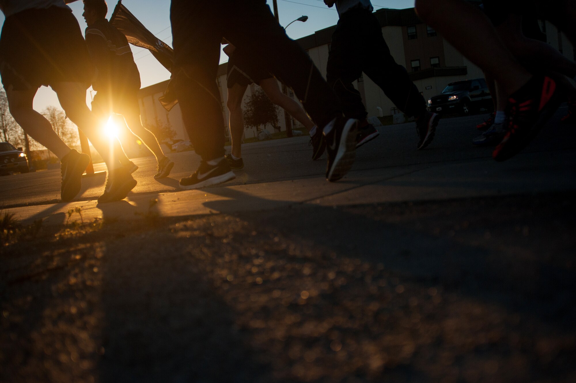 U.S. Airmen assigned to Detachment 1, 3rd Air Operations Support Squadron, participate in a POW/MIA 24-hour vigil run during National POW/MIA Recognition Day at Eielson Air Force Base, Alaska, Sept. 19, 2014.  The third Friday of September each year is observed across the United States as National POW/MIA Recognition Day to honor prisoners of war and the missing as well as their families and highlights the government's commitment to account for them. (U.S. Air Force photo by Tech. Sgt. Joseph Swafford/Released)