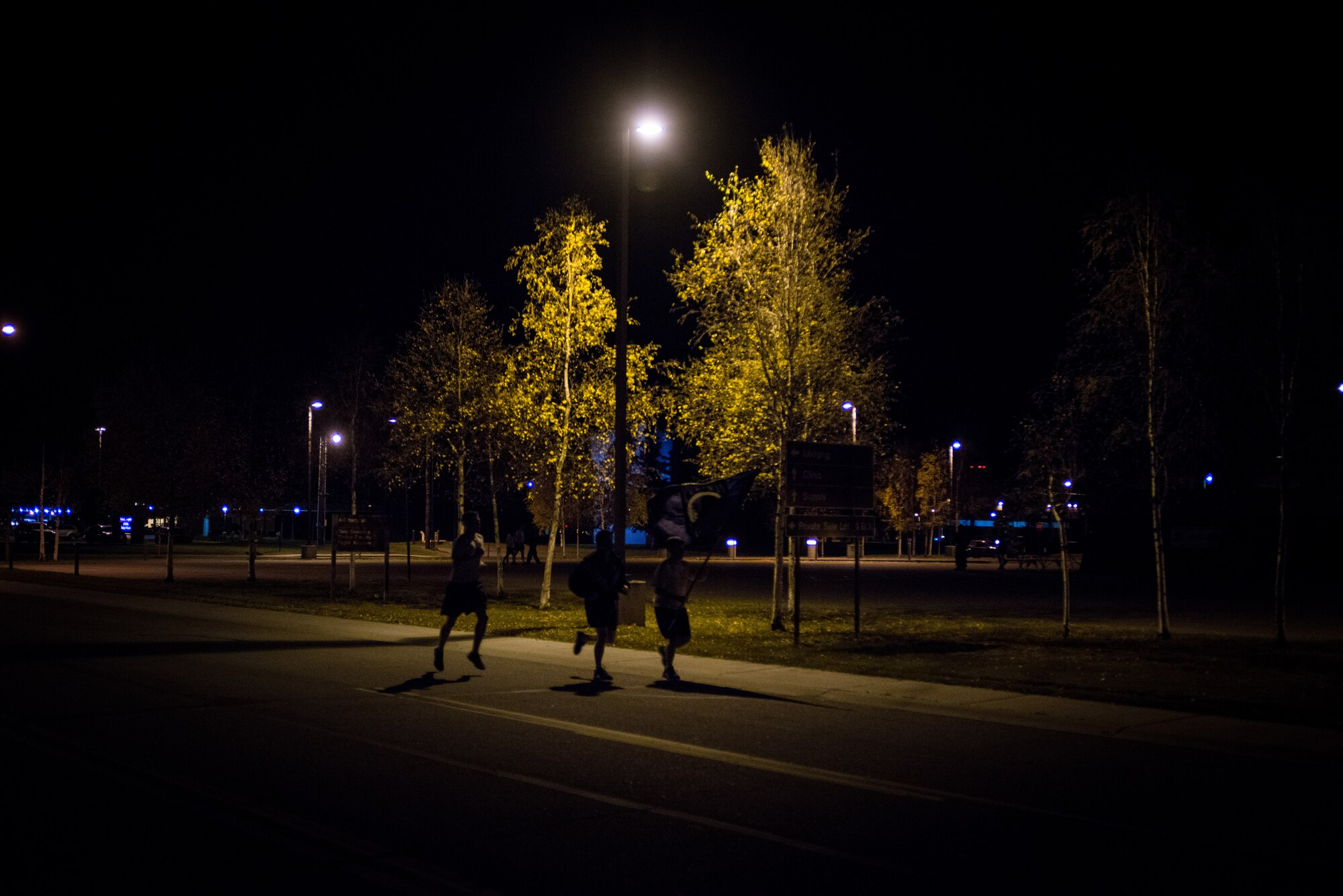 U.S. Airmen participate in a POW/MIA 24-hour vigil run during National POW/MIA Recognition Day at Eielson Air Force Base, Alaska, Sept. 18, 2014.  The third Friday of September each year is observed across the United States as National POW/MIA Recognition Day to honor prisoners of war and the missing as well as their families and highlights the government's commitment to account for them. (U.S. Air Force photo by Tech. Sgt. Joseph Swafford/Released)
