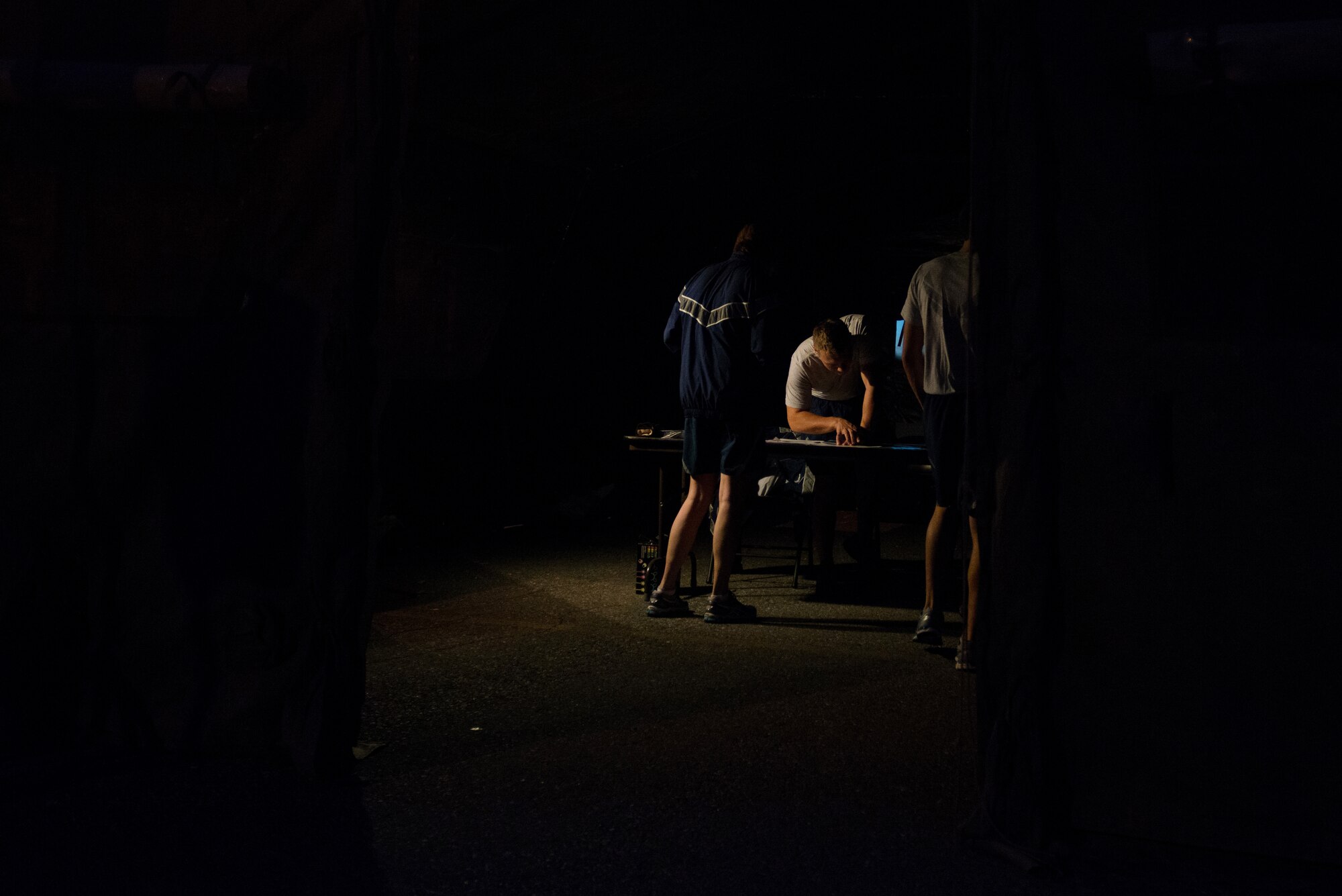 U.S. Airmen check in before participating in a POW/MIA 24-hour vigil run during National POW/MIA Recognition Day at Eielson Air Force Base, Alaska, Sept. 18, 2014.  The third Friday of September each year is observed across the United States as National POW/MIA Recognition Day to honor prisoners of war and the missing as well as their families and highlights the government's commitment to account for them. (U.S. Air Force photo by Tech. Sgt. Joseph Swafford/Released)