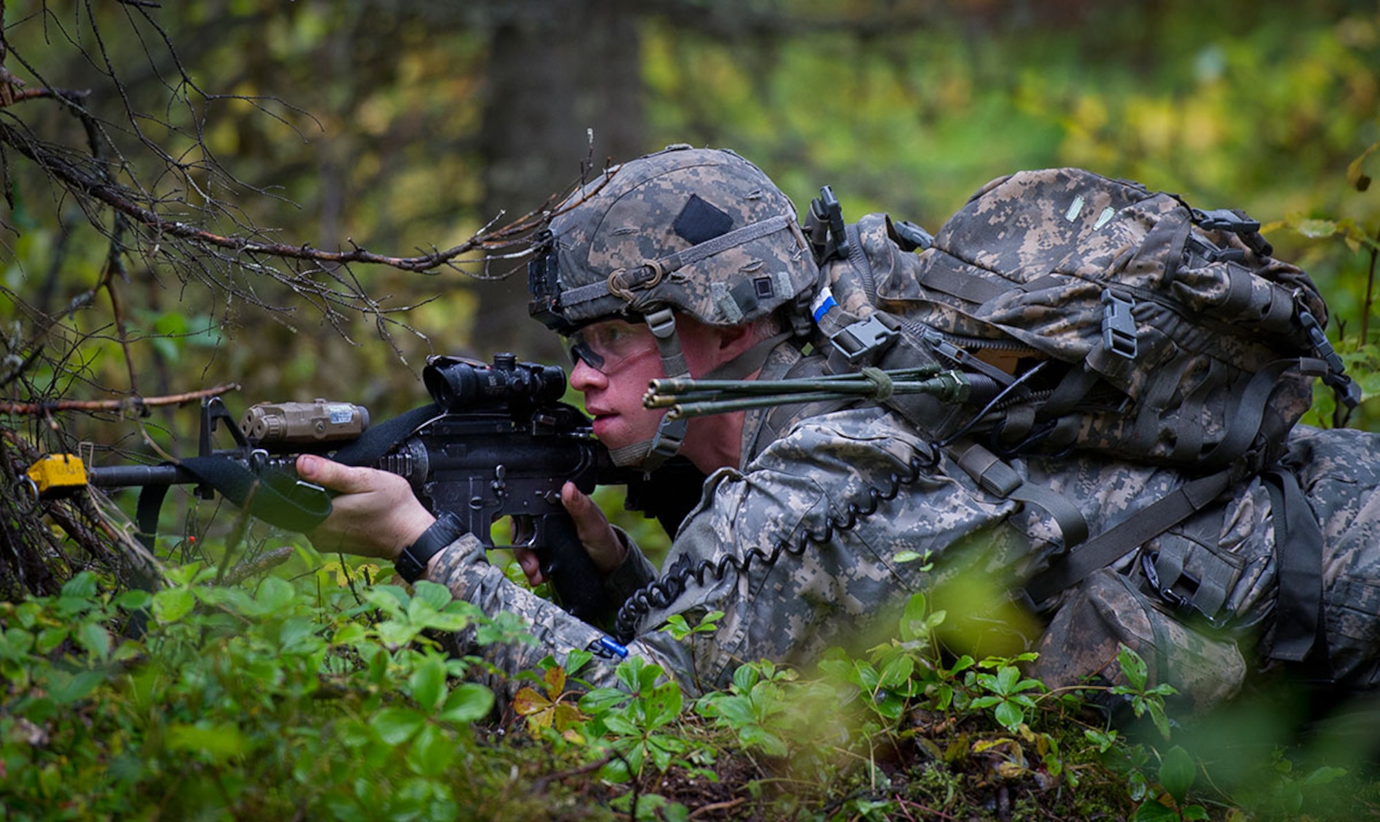 Army Private 1st Class Marcus Deluca, a native of Franklin Mass., assigned to the 1st Battalion (Airborne), 501st Infantry Regiment, 4th Infantry Brigade Combat Team (Airborne), 25th Infantry Division, U.S. Army Alaska, takes aim at a sniper on an Expert Infantryman Badge qualification lane on Joint Base Elmendorf-Richardson, Wednesday, Sept. 10, 2014. The Expert Infantryman Badge was approved by the Secretary of War on October 7, 1943, and is currently awarded to U.S. Army personnel who hold infantry or special forces military occupational specialties and successfully pass the rigors of the course. (U.S. Air Force photo/Justin Connaher)