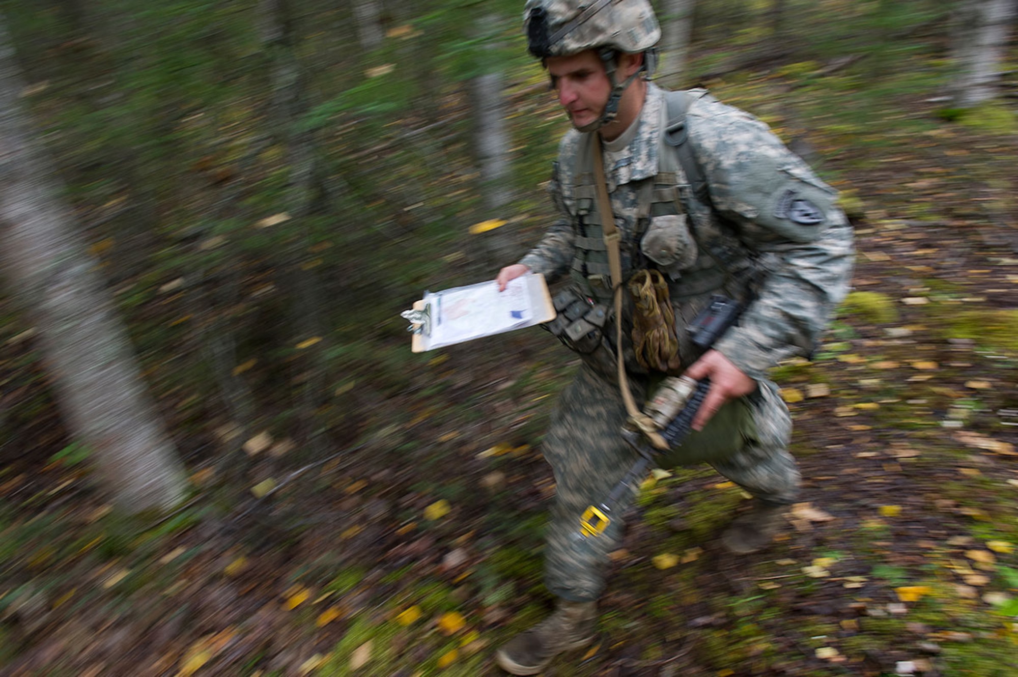 Spc. Mattew Ward, a native of Westminster, Md., assigned to Dog Company, 3rd Battalion (Airborne), 509th Infantry Regiment, 4th Infantry Brigade Combat Team (Airborne), 25th Infantry Division, U.S. Army Alaska, moves to a point on the land navigation course during Expert Infantryman Badge qualification on Joint Base Elmendorf-Richardson, Tuesday, Sept. 9, 2014. The Expert Infantryman Badge was approved by the Secretary of War on October 7, 1943, and is currently awarded to U.S. Army personnel who hold infantry or special forces military occupational specialties and successfully pass the rigors of the course. (U.S. Air Force photo/Justin Connaher)