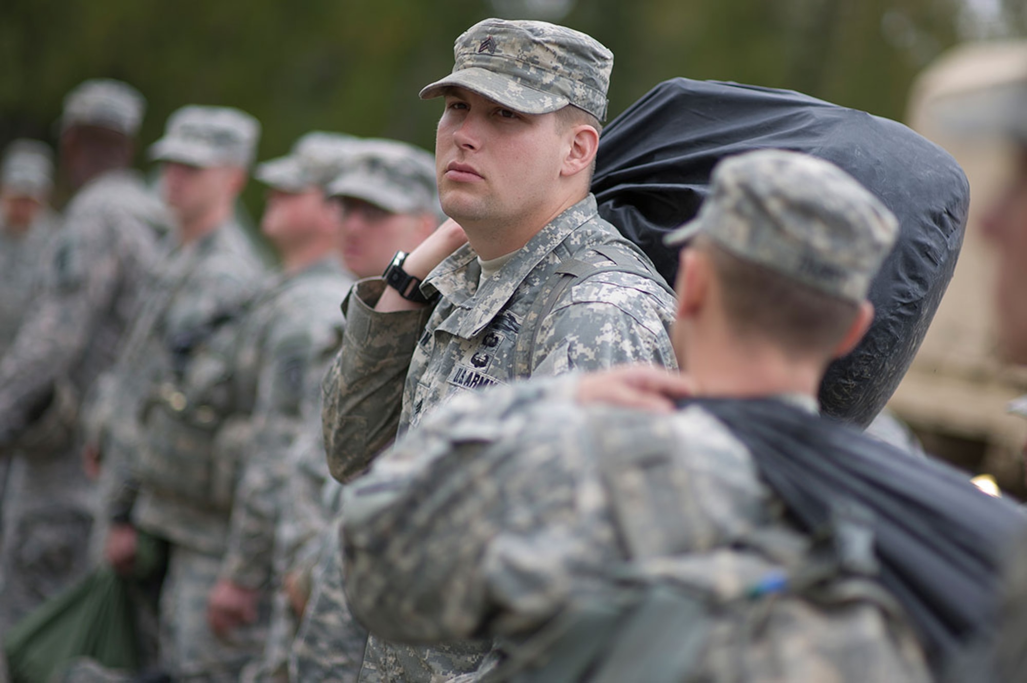 Army Sgt. Christopher Cureton, a native of Las Vegas, assigned to Deleware Company, 1st Battalion (Airborne), 501st Infantry Regiment, 4th Infantry Brigade Combat Team (Airborne), 25th Infantry Division, U.S. Army Alaska, stands in a formation awaiting instructions from cadre during Expert Infantryman Badge qualification on Joint Base Elmendorf-Richardson, Tuesday, Sept. 9, 2014. The Expert Infantryman Badge was approved by the Secretary of War on October 7, 1943, and is currently awarded to U.S. Army personnel who hold infantry or special forces military occupational specialties and successfully pass the rigors of the course. (U.S. Air Force photo/Justin Connaher)