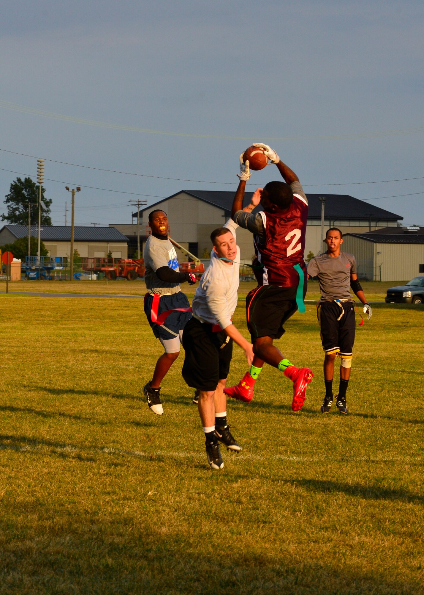 Terrell Parker, Air Force Mortuary Affairs Operations wide receiver, catches a pass during a flag football game Sept. 18, 2014, at Dover Air Force Base, Del. AFMAO lost their first game of the season 13-0 against the 436th Logistics Readiness Squadron. (U.S. Air Force photo/Airman 1st Class William Johnson) 