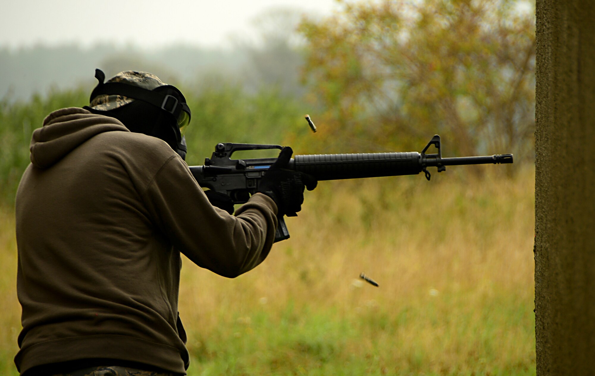 An Airman from the 48th Mission Support Group fires an M-16 assault rifle during a force-on-force exercise at Stanford Training Area, England, Sept. 19, 2014. The three-day training included small unit tactics training to familiarize Airmen with the M16 and M4 rifles and the M9 pistol. (U.S. Air Force photo by Airman 1st Class Erin O’Shea/Released)   