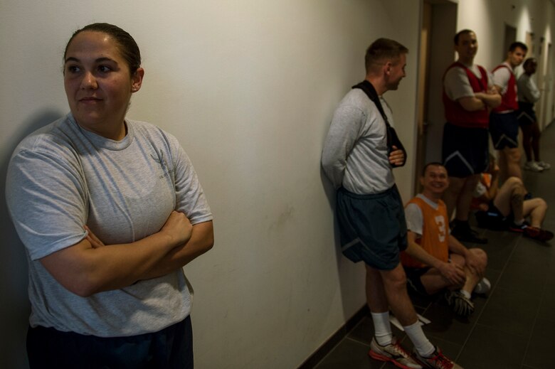 U.S. Air Force Staff Sgt. India Smith, 372nd Training Squadron Detachment 17 NCO in charge of knowledge operations, waits to take her physical fitness test Sept. 22, 2014, at Spangdahlem Air Base, Germany. Smith underwent a six-month transformation, losing 18 pounds and over 40 inches on her overall measurements. (U.S. Air Force photo by Senior Airman Rusty Frank/Released)