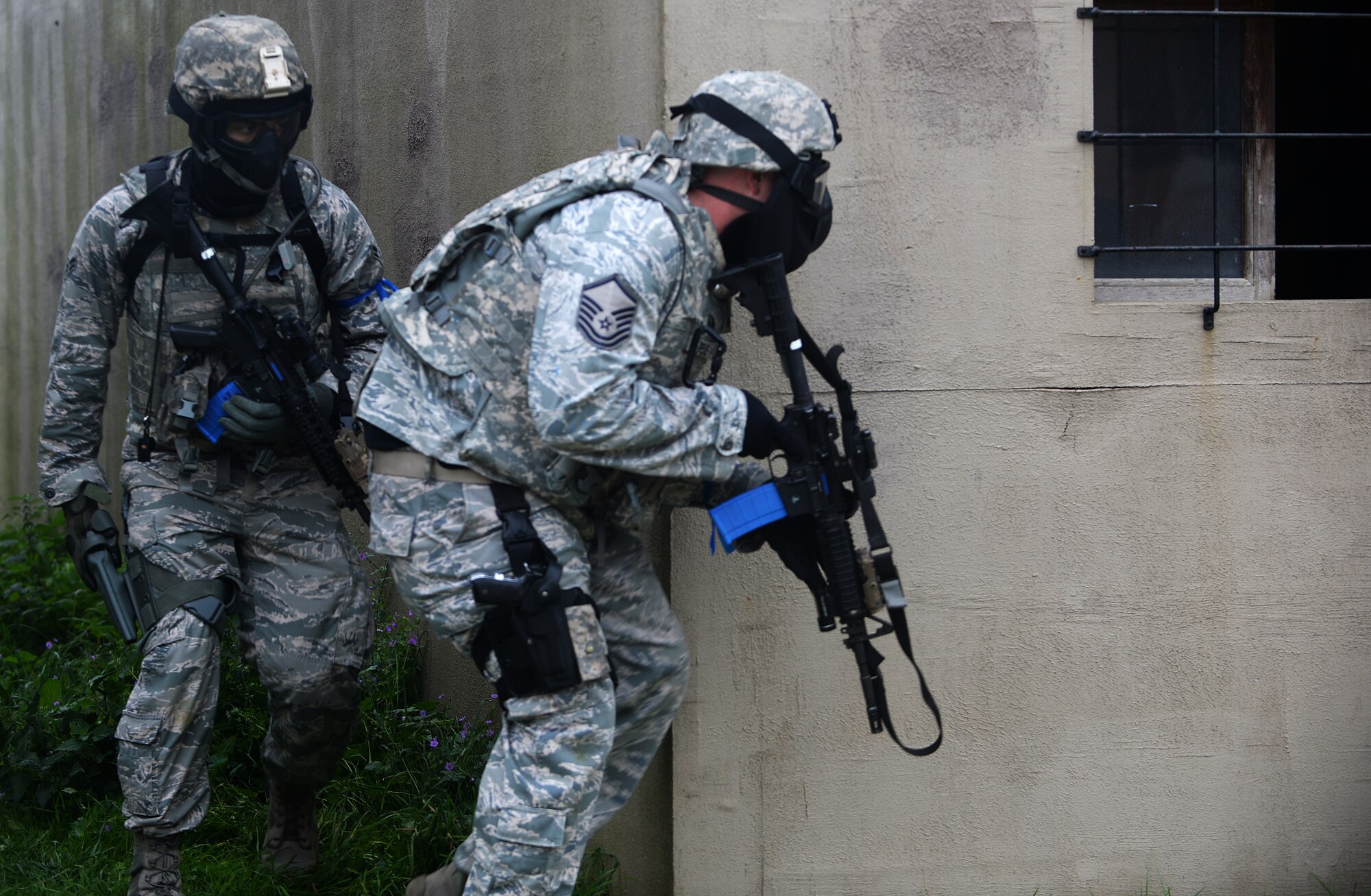 Master Sgt. Matthew Pease, 48th Security Forces Squadron plans and programs superintendent, advances to another tactical position during a force-on-force exercise at the Stanford Training Area in Norfolk, England, Sept. 19, 2014. The three-day training included Airmen convoying out to the site and embedded in a mock village. (U.S. Air Force photo by Staff Sgt. Emerson Nuñez/Released)