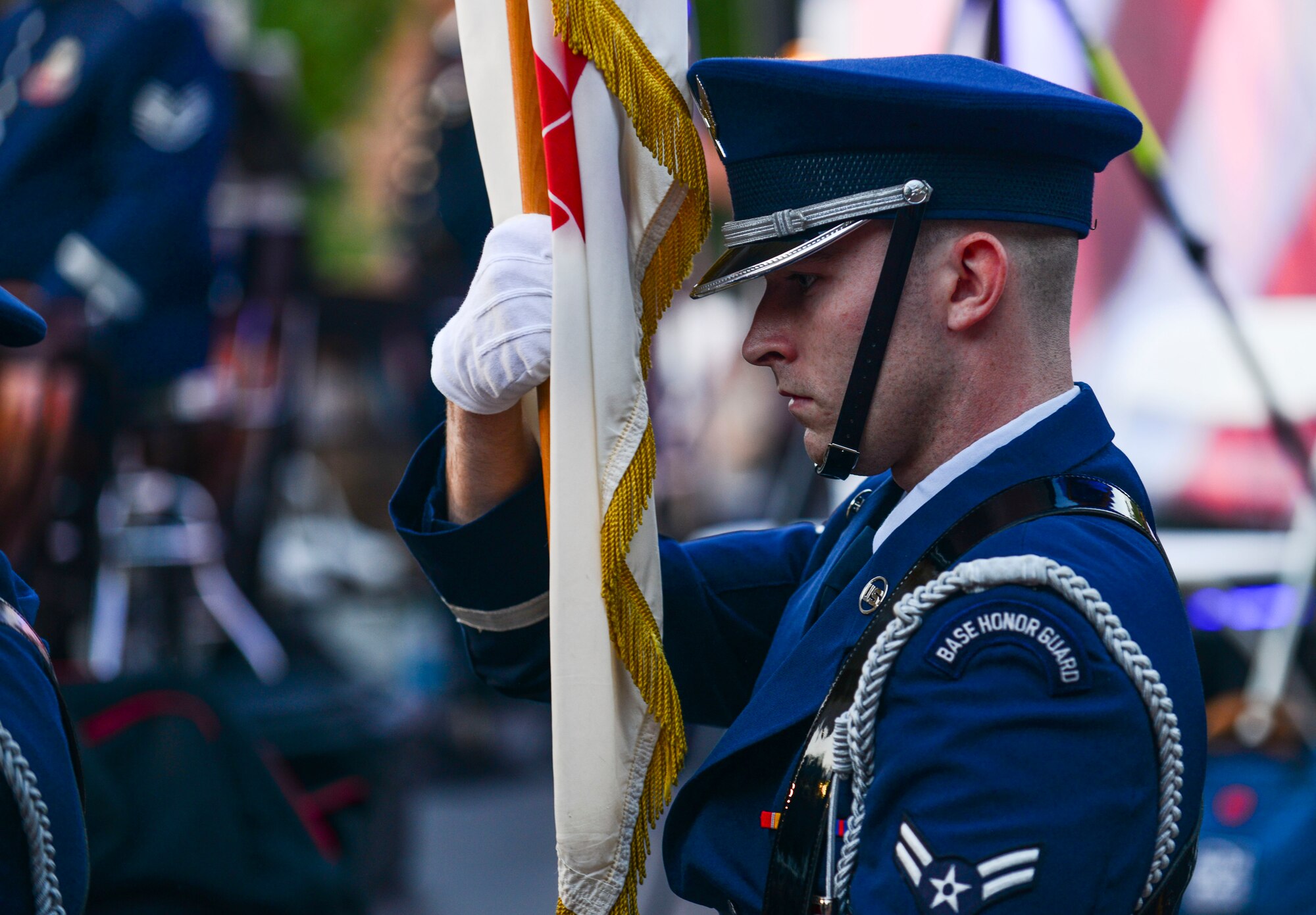U.S. Air Force Airman 1st Class Christopher Freeman, Langley Honor Guard ceremonial guardsmen, prepares to present the colors during the Constitution Day “Support and Defend” concert in Williamsburg, Va., Sept 17, 2014. The honor guard is a congressionally-mandated program that provides well-trained, highly-professional members to honor and carry out the primary mission of rendering funeral honors. (U.S. Air Force photo by Airman 1st Class Kimberly Nagle/Released)