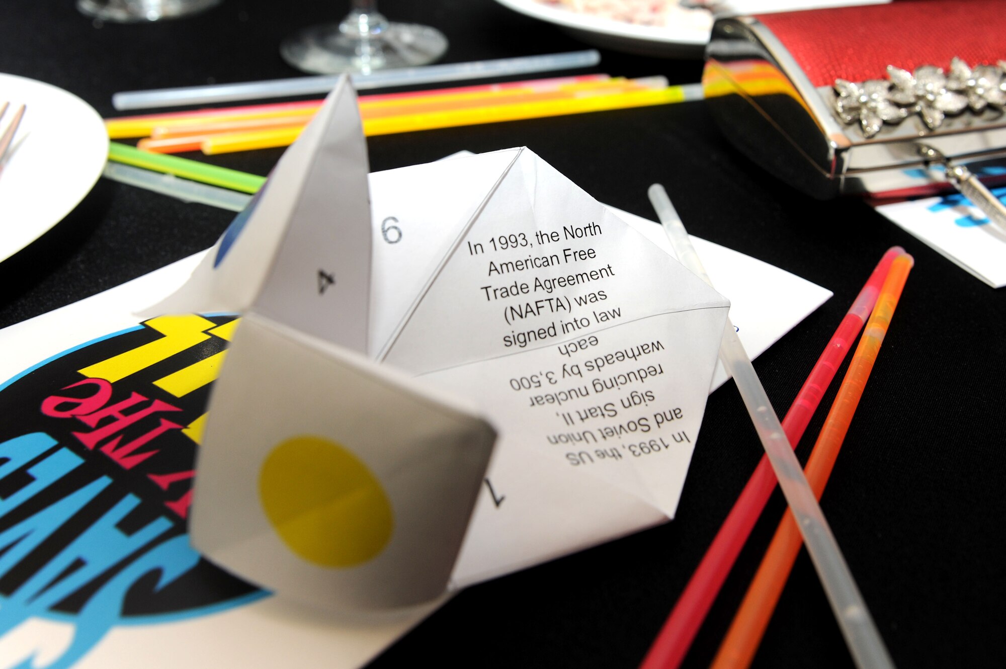 A paper fortune teller sits on a table at the Air Force Ball Sept. 20, 2014, on RAF Mildenhall, England. The ‘90s themed event titled “Saved by the Ball” celebrated the Air Force’s 67th birthday as an independent service with glow sticks, CDs, slap bracelets, ‘90s music including a ‘90s cover band and grunge-dressed food servers. (U.S. Air Force photo/Senior Airman Kate Maurer/Released)