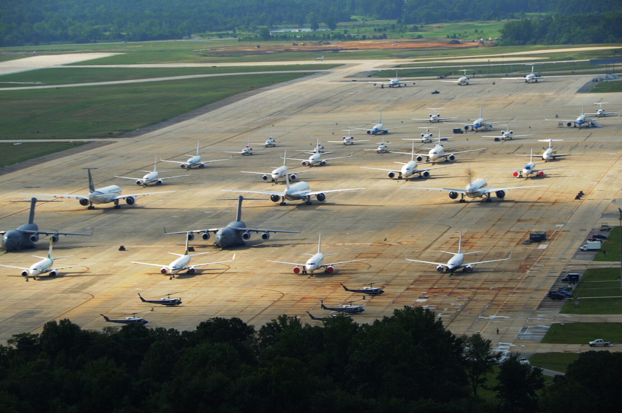 Military and foreign dignitary aircraft stagger together on the flight line during the U.S.-Africa Leaders' Summit on Joint Base Andrews, Maryland, Aug. 6, 2014. Contingency response is just one of Air Force District of Washington’s core mission sets, which also includes ceremonial honors and operational support.  The command reactivated in 2005 to address three broad objectives: to align the Air Force command structure in the NCR with its sister services; to improve Air Force support to the Joint Force Headquarters-National Capital Region; and to designate a single voice for Air Force cross-service issues in the NCR. (U.S. Air Force photo/Staff Sgt. Matt Davis)