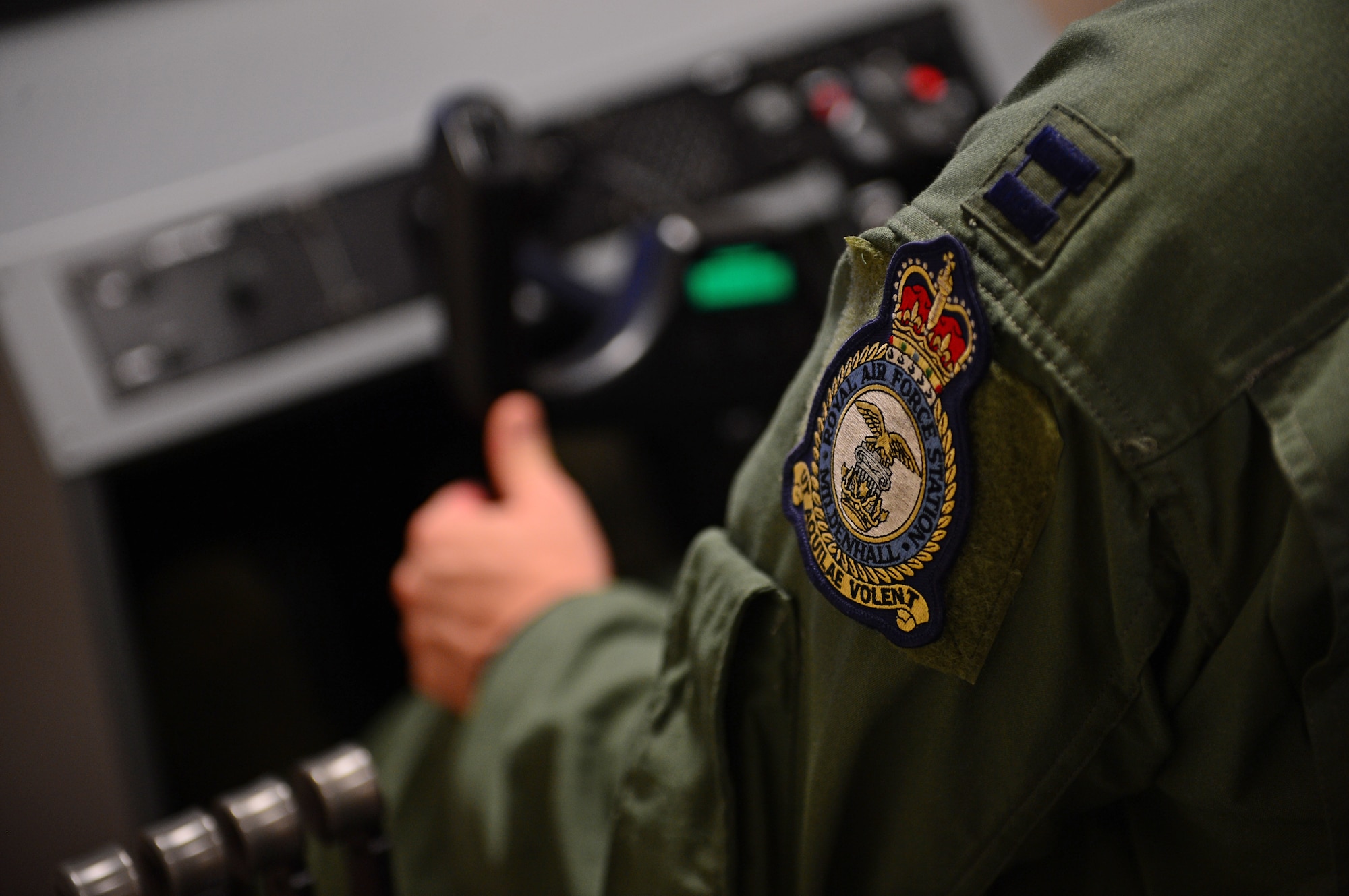 Capt. David Cox, 100th Operations Group training assistant chief, flies an aircraft simulator during simulated hypoxia training at Royal Air Force Lakenheath, England, Sept. 17, 2014. As part of a safety requirement, aircrew attend hypoxia refresher training every five years to become re-introduced to the symptoms of hypoxia. (U.S. Air Force photo by Airman 1st Class Erin O’Shea/Released) 