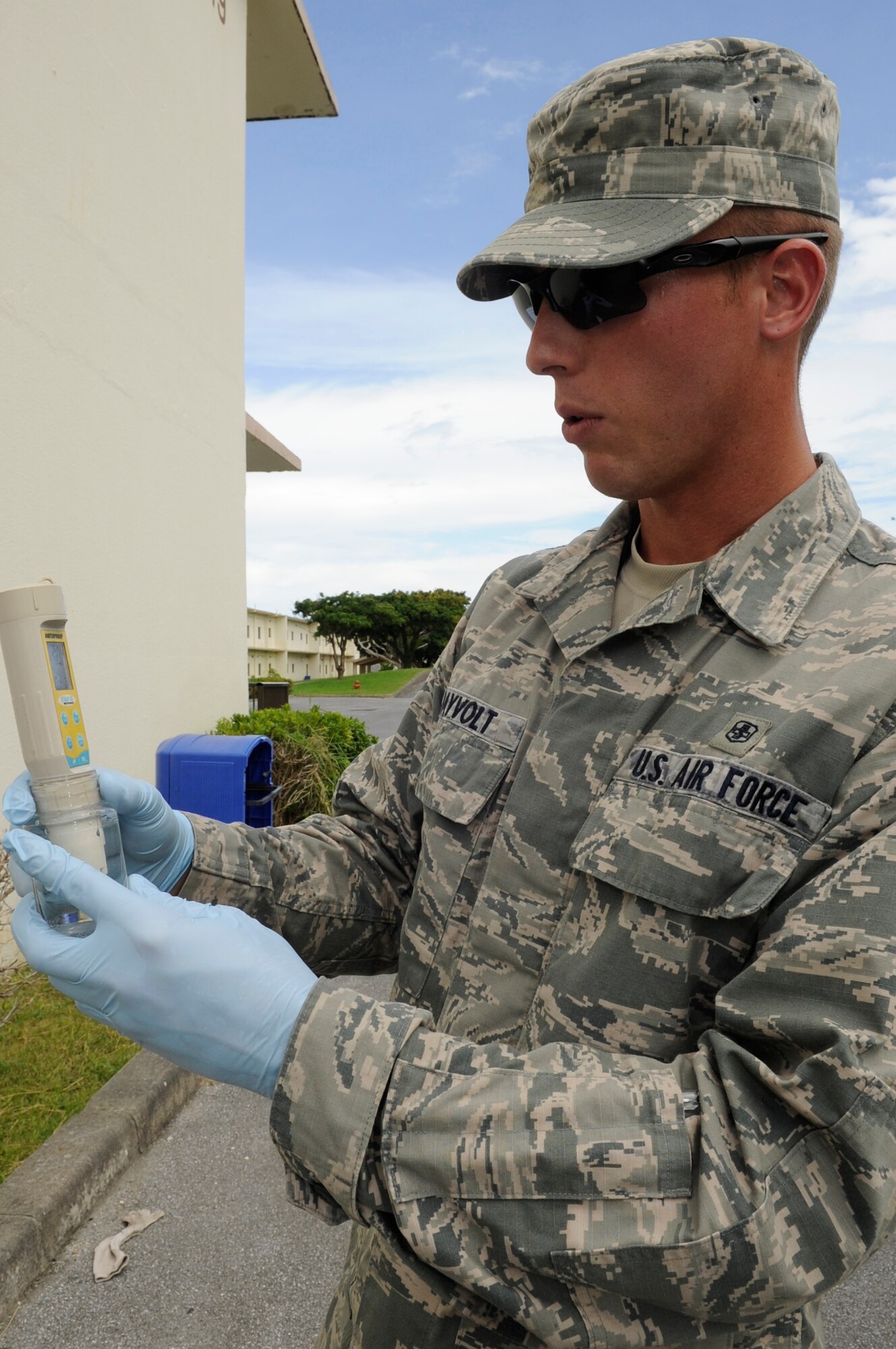 U.S. Air Force Senior Airman Dustin Dayvolt, 18th Aerospace Medicine Squadron bioenvironmental engineering technician, tests the pH of a water sample on Kadena Air Base, Japan, Sept. 23, 2014. The bioenvironmental engineers test for total coliform and if the results are positive, they test for fecal coliform, or E. coli. (U.S. Air Force photo by Senior Airman Marcus Morris/Released)