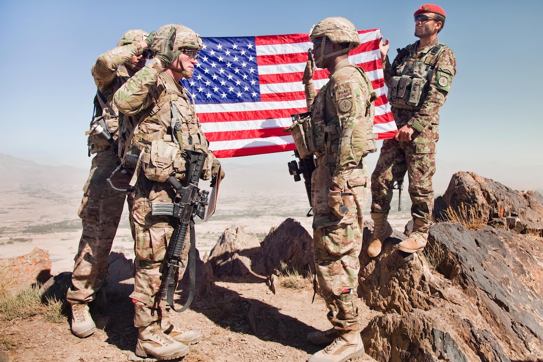 U.S. Army Col. Cameron M. Cantlon, left, reenlists U.S. Army Sgt ...