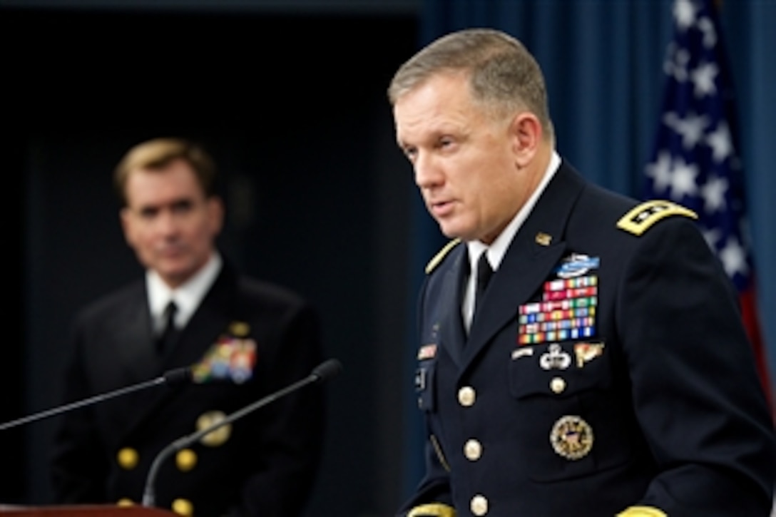 Army Lt. Gen. William C. Mayville Jr., director of operations for the Joint Chiefs of Staff, briefs reporters on current operations in Syria as Pentagon Press Secretary Navy Rear Adm. John Kirby looks on at the Pentagon, Sept. 23, 2014.  