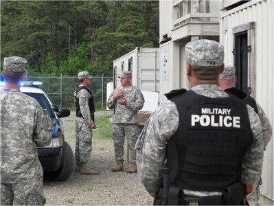 1st Lt. Kevin McDermitt, Massachusetts Army National Guard, instructs Guardsmen in patrol procedures at Joint Base Cape Cod on June, 11, 2014. McDermitt, who is also a Massachusetts State Police Trooper, is one of many dual-career police professionals who serve the commonwealth in a civilian and military capacity. The Massachusetts National Guard’s Police Mission Partnership Initiative (PMPI) began in 2012 to systematically improve its domestic police support capability and individual law enforcement career opportunities for its personnel. 