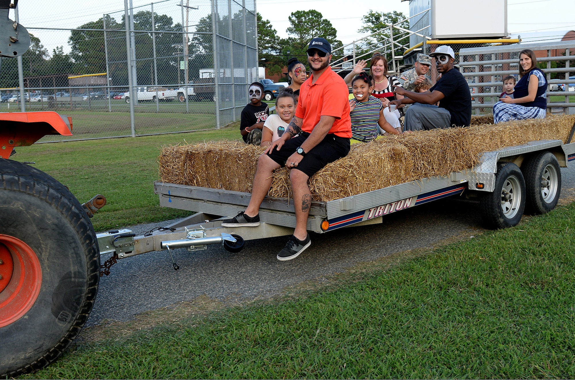 Members of the local community take a hay ride around the annual Oktoberfest celebration at Fort Eustis, Va., Sept. 19, 2014. The celebration continued the following day, Sept. 20 for the younger crowd with a fall festival, “Kinderfest.”  (U.S. Air Force photo by Staff Sgt. Teresa J. Cleveland/Released)