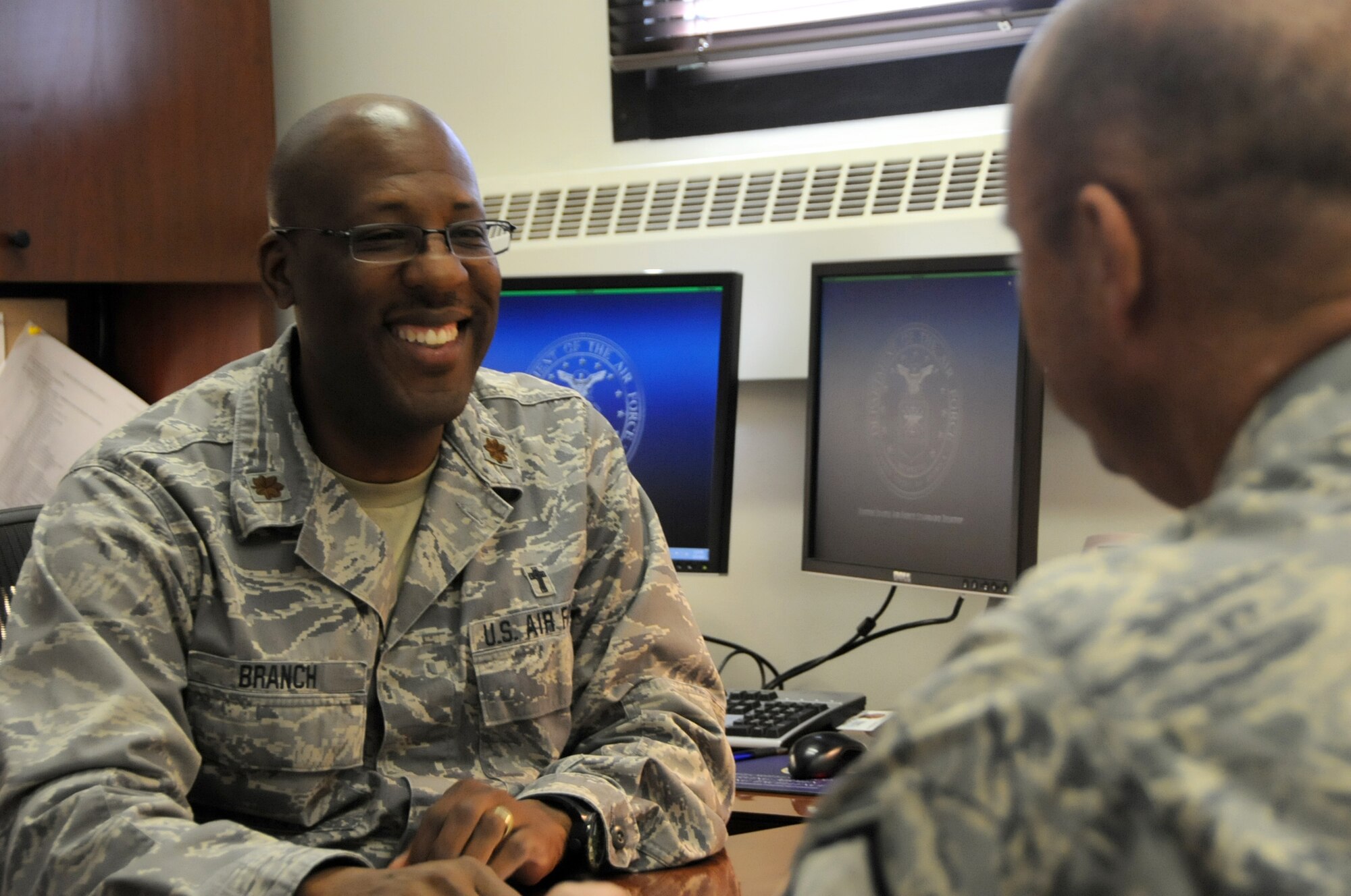 Chaplain (Maj.) Joseph Branch of the 178th Wing speaks with an Airman in his office Sept. 23, 2014. Branch is a full-time chaplain for the wing and provides a myriad of services including grief counseling, relationship counseling, substance abuse awareness and prevention, suicide awareness and prevention, and freedom of religion. (Ohio Air National Guard photo by Senior Master Sgt. Joseph Stahl/Released)