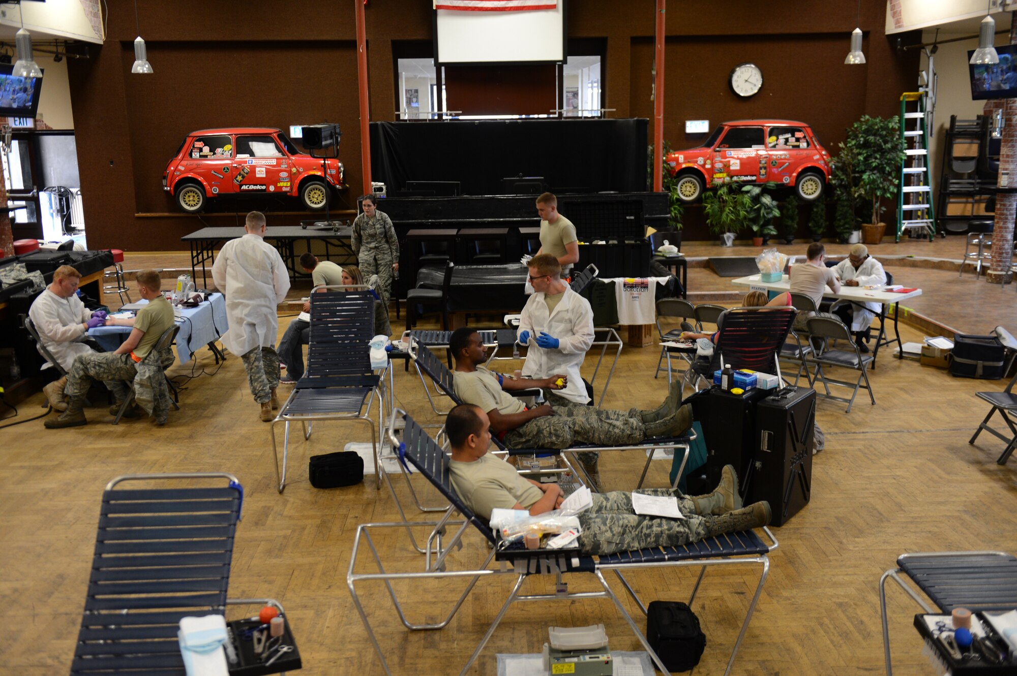 Spangdahlem Airmen participate in an Armed Services Blood Program blood drive at the Brick House on Spangdahlem Air Base, Germany, Sept. 23, 2014. The ASBP travels to Spangdahlem approximately once every two months and facilitates more than 50 donors each visit. (U.S. Air Force photo by Senior Airman Gusavo Castillo/Released) 
