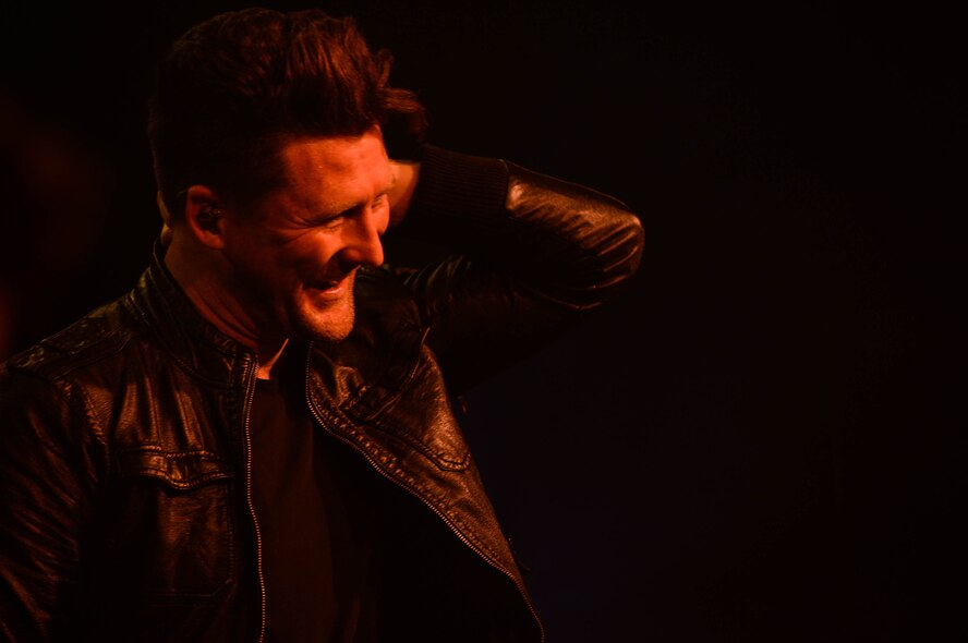 Stephen Christian, a lead vocalist for Anberlin, smiles at the audience during a concert in the Skelton Memorial fitness center at Spangdahelm Air Base, Germany, Sept. 22, 2014. More than 100 people attended the free concert to see one of the band’s last European tour performances. The band plans to disband after their final tour in the United States.  (U.S. Air Force photo by Airman 1st Class Kyle Gese/Released)