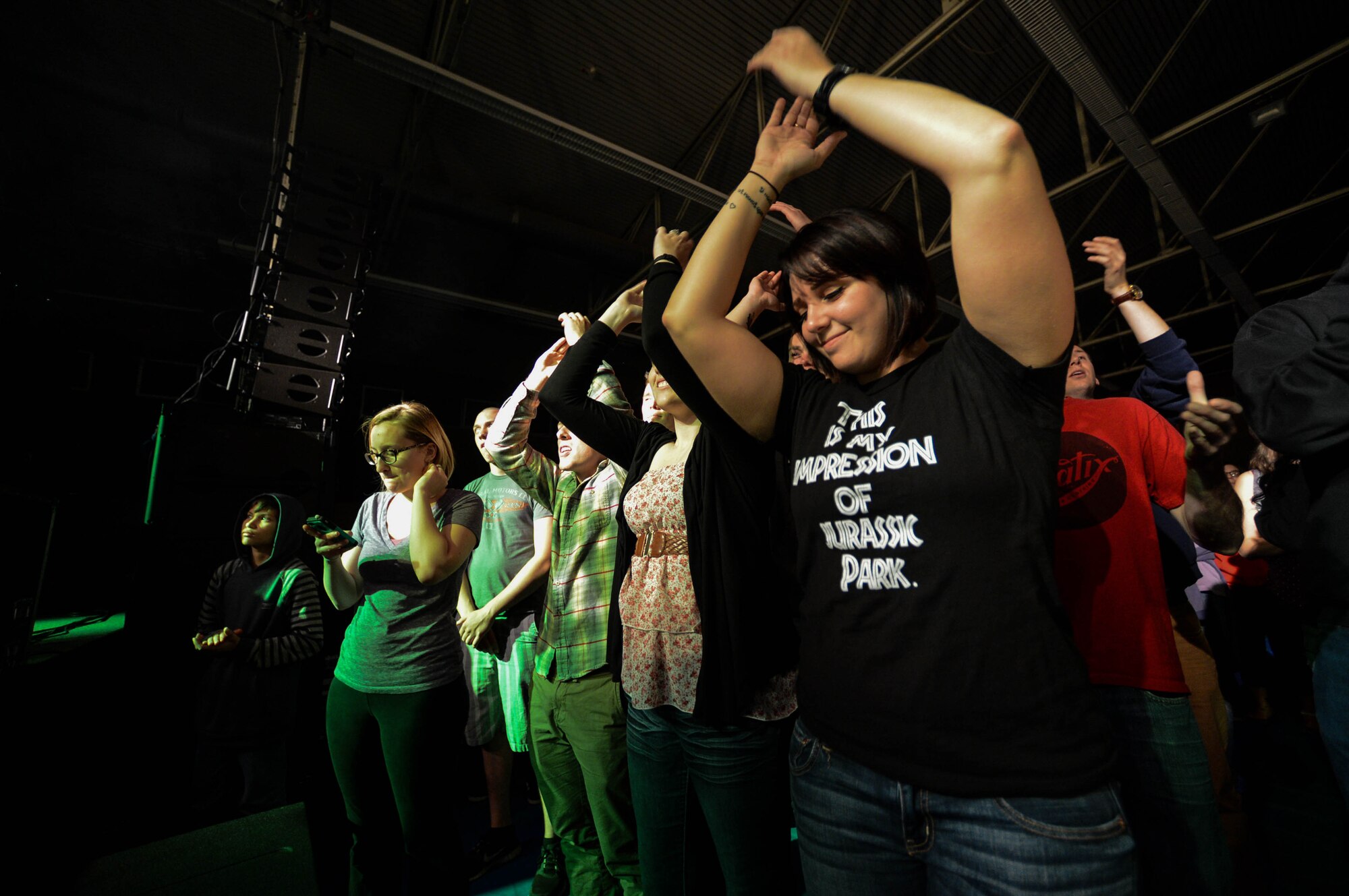 U.S. Air Force Staff Sgt. Lauren Saiz, a 52nd Comptroller Squadron financial services technician and native of Royse City, Texas, listens to Florida-based band Anberlin perform in the Skelton Memorial fitness center at Spangdahlem Air Base, Germany, Sept. 22, 2014. Anberlin released seven albums and plans to disband after their final U.S. tour this year. (U.S. Air Force photo by Airman 1st Class Kyle Gese/Released)